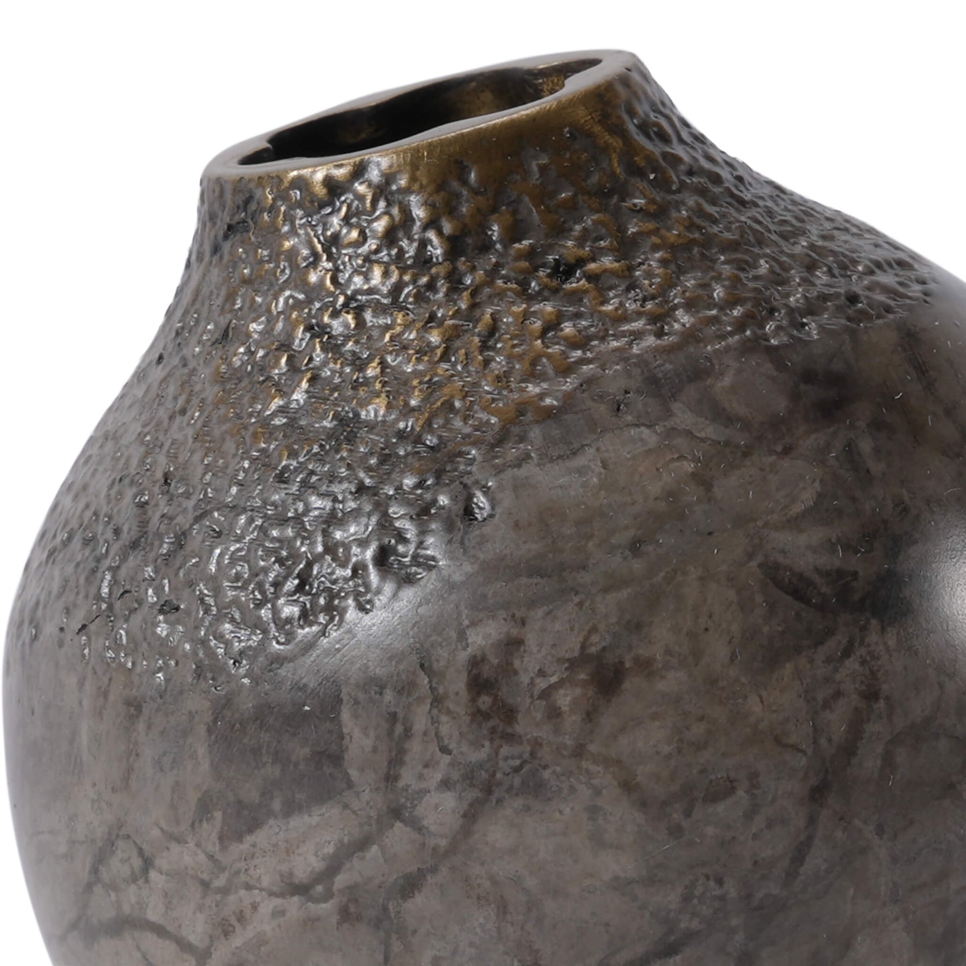 Close-up of the ARTAMORE solid brass acorn vase, revealing the fine handcrafted lines, minor oxidation, and natural brass properties
