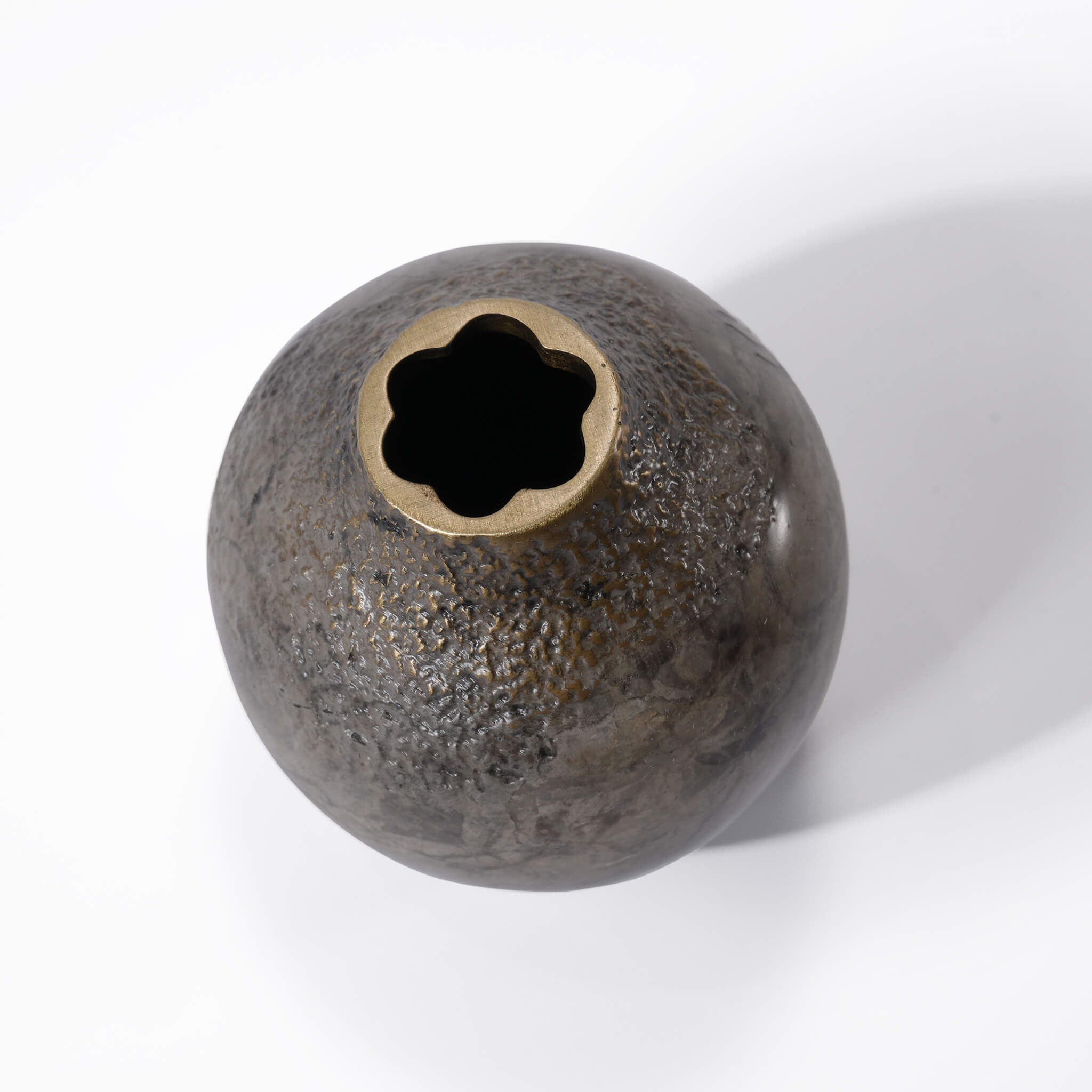 Top-down view of the solid brass acorn vase focusing on the playful, irregular petal-shaped rim opening