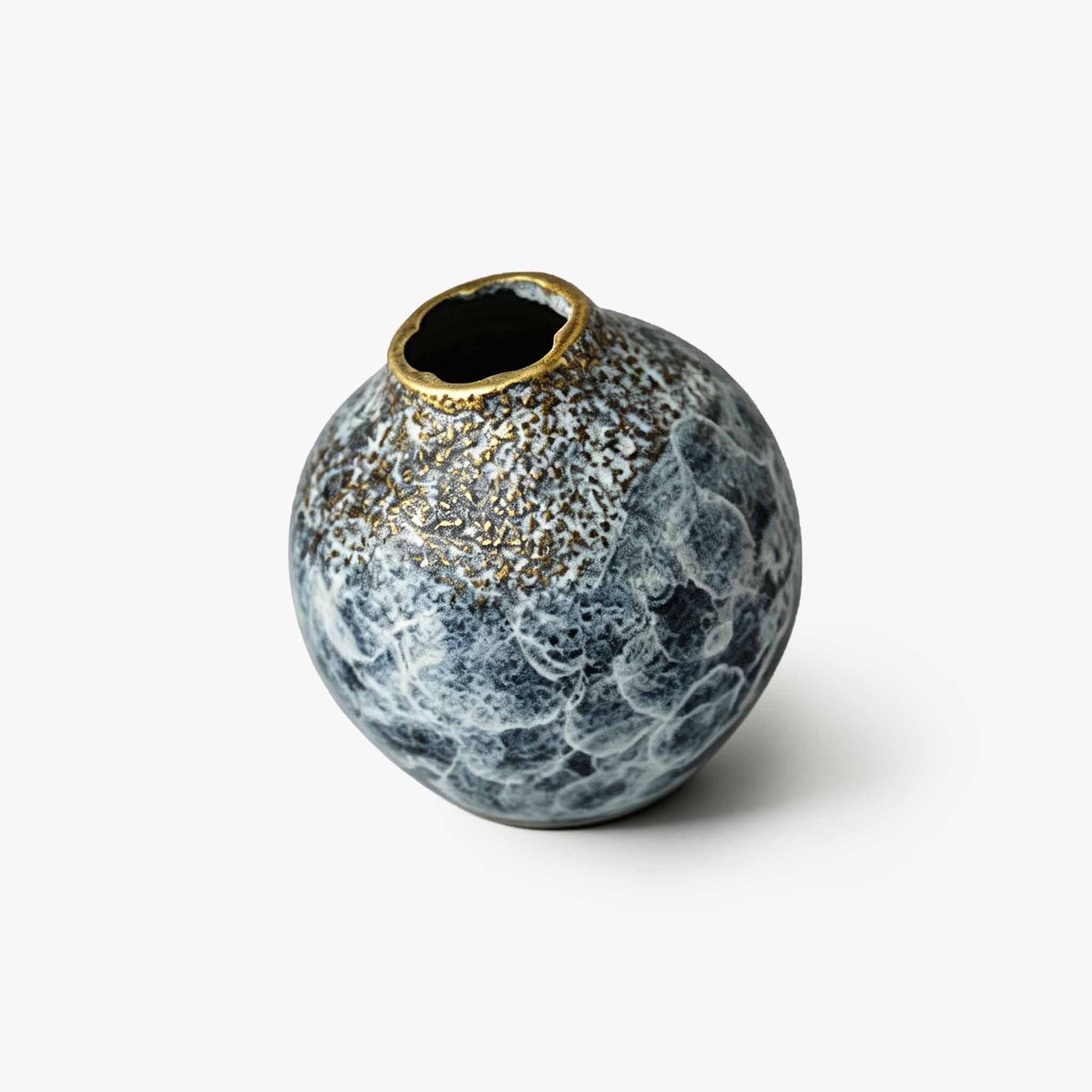 Handcrafted solid brass miniature bud vase featuring an organic textured finish and elegant petal rim.