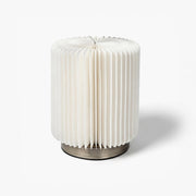 Premium kraft paper desk lamp featuring an accordion shade for minimalist interiors.