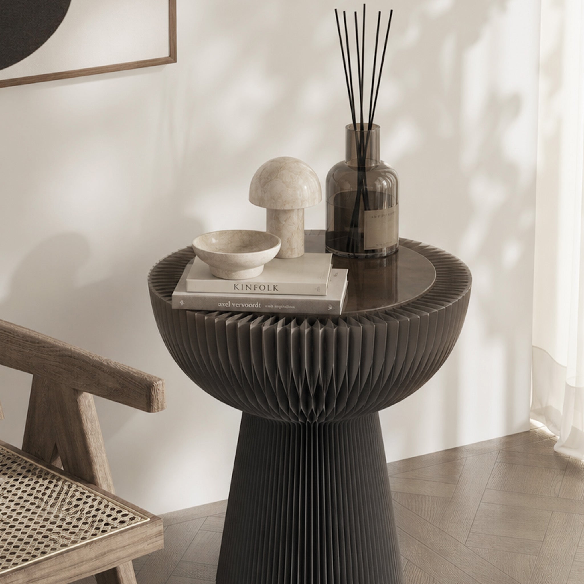 Grey Bouquet Side Table B styled with fragrance, books and decorative objects beside a lounge chair.