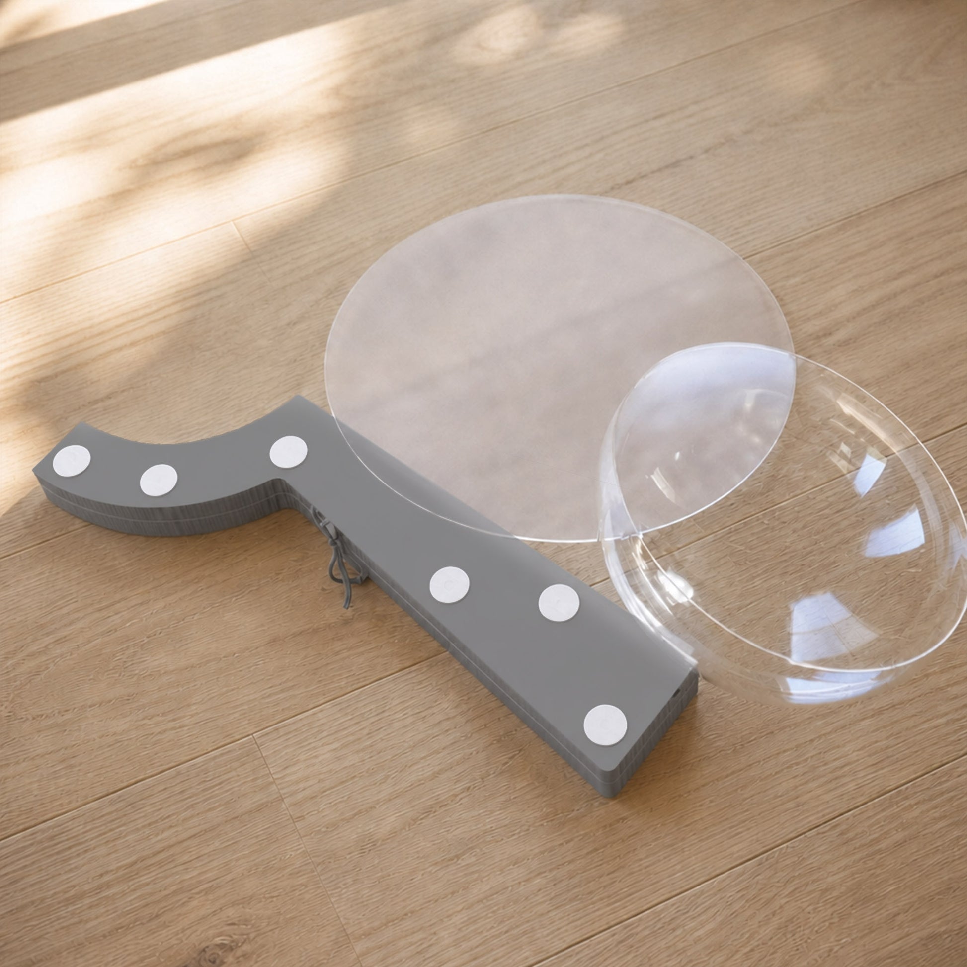 Folded grey Bouquet Side Table B with acrylic tabletop and clear dome prepared for compact storage.