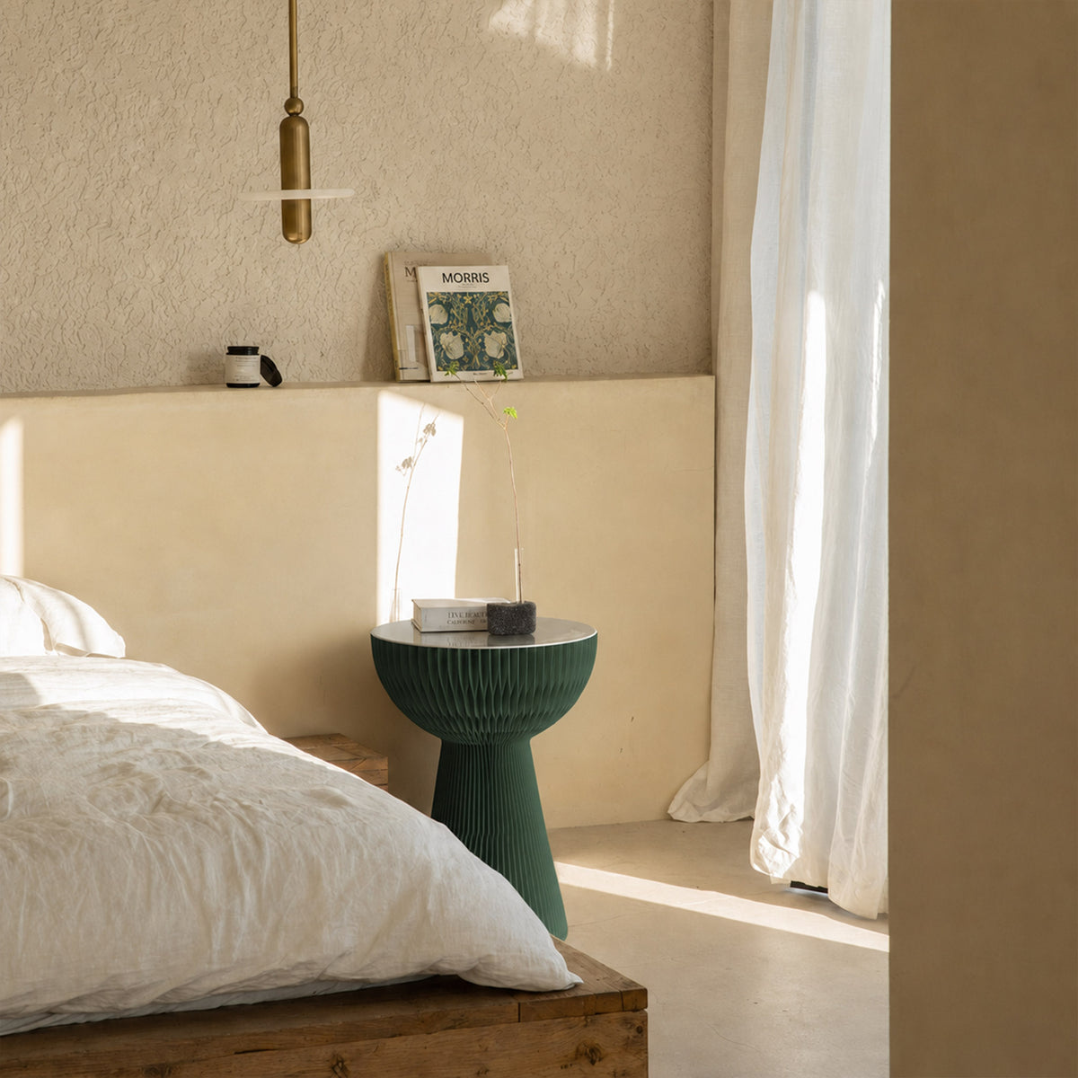 Pine green Bouquet Side Table B used as a bedside table with books and minimalist decor.