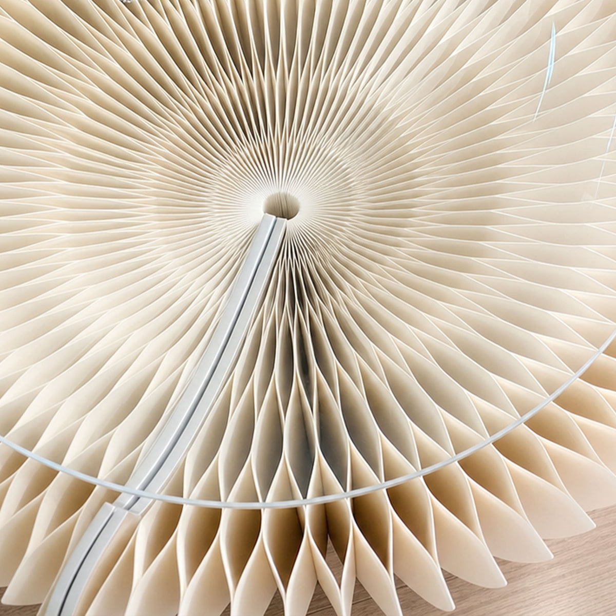 Detailed view of the white Bouquet Side Table B showing its hexagonal honeycomb paper construction.