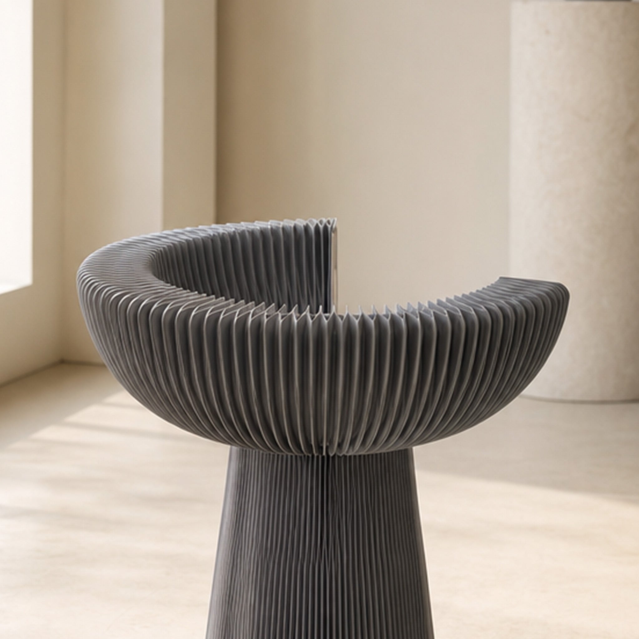Grey Bouquet Side Table C partially opened to show its flexible foldable honeycomb paper construction.
