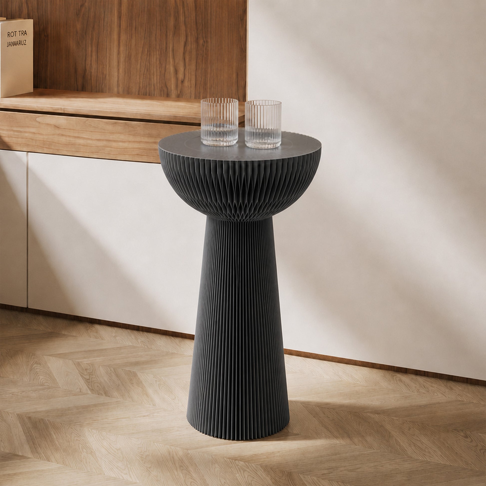 Grey Bouquet Side Table C with a tall honeycomb paper silhouette styled with two glasses in a modern living space.