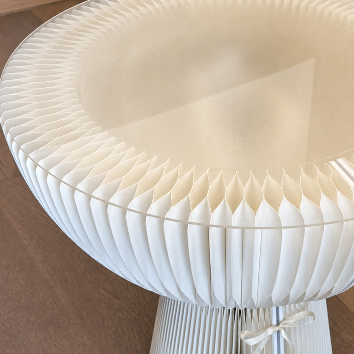 Close-up of the white Bouquet Side Table C showing its layered honeycomb paper structure and clear acrylic edge.
