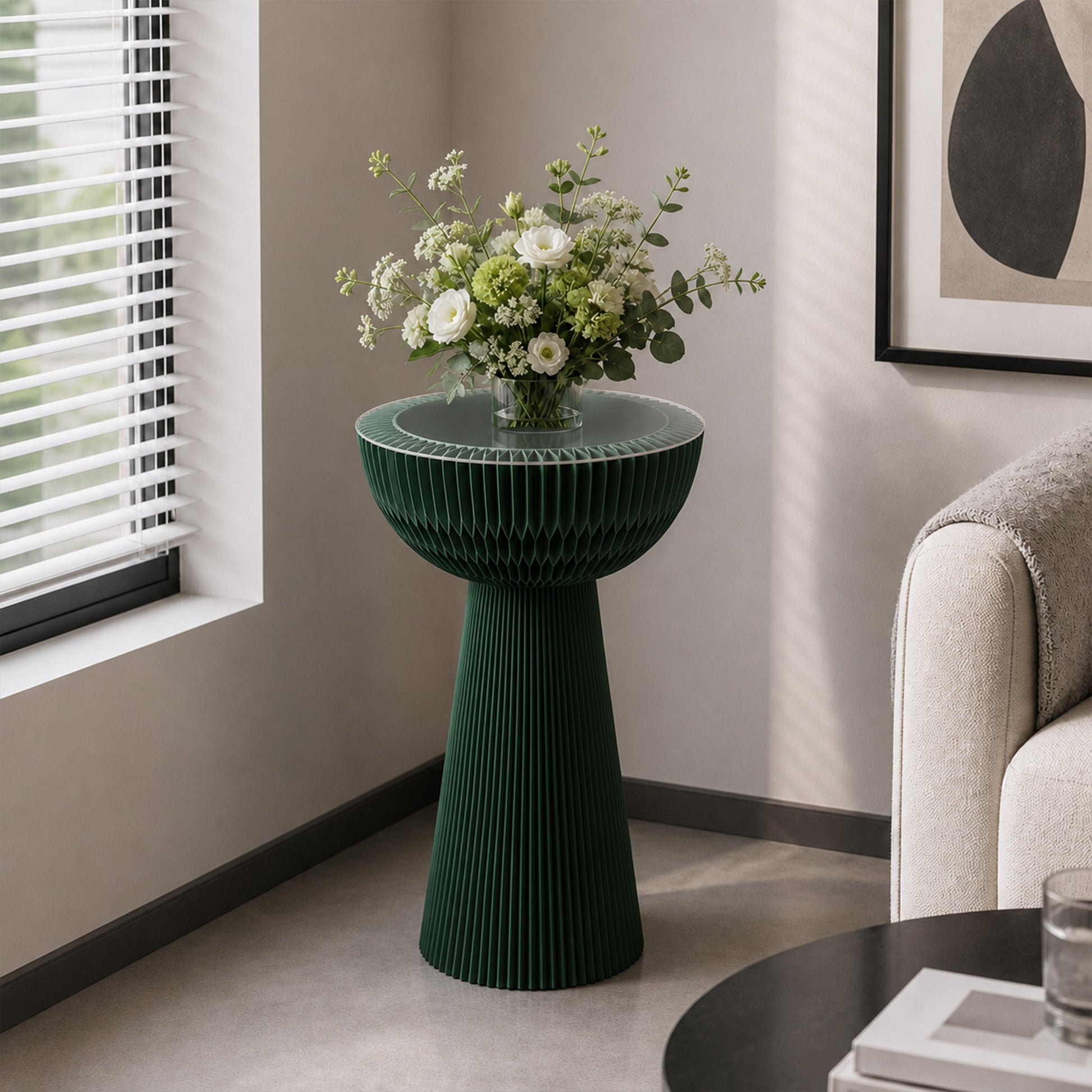 Pine green Bouquet Side Table C styled with a floral arrangement beside a sofa in a contemporary living room.