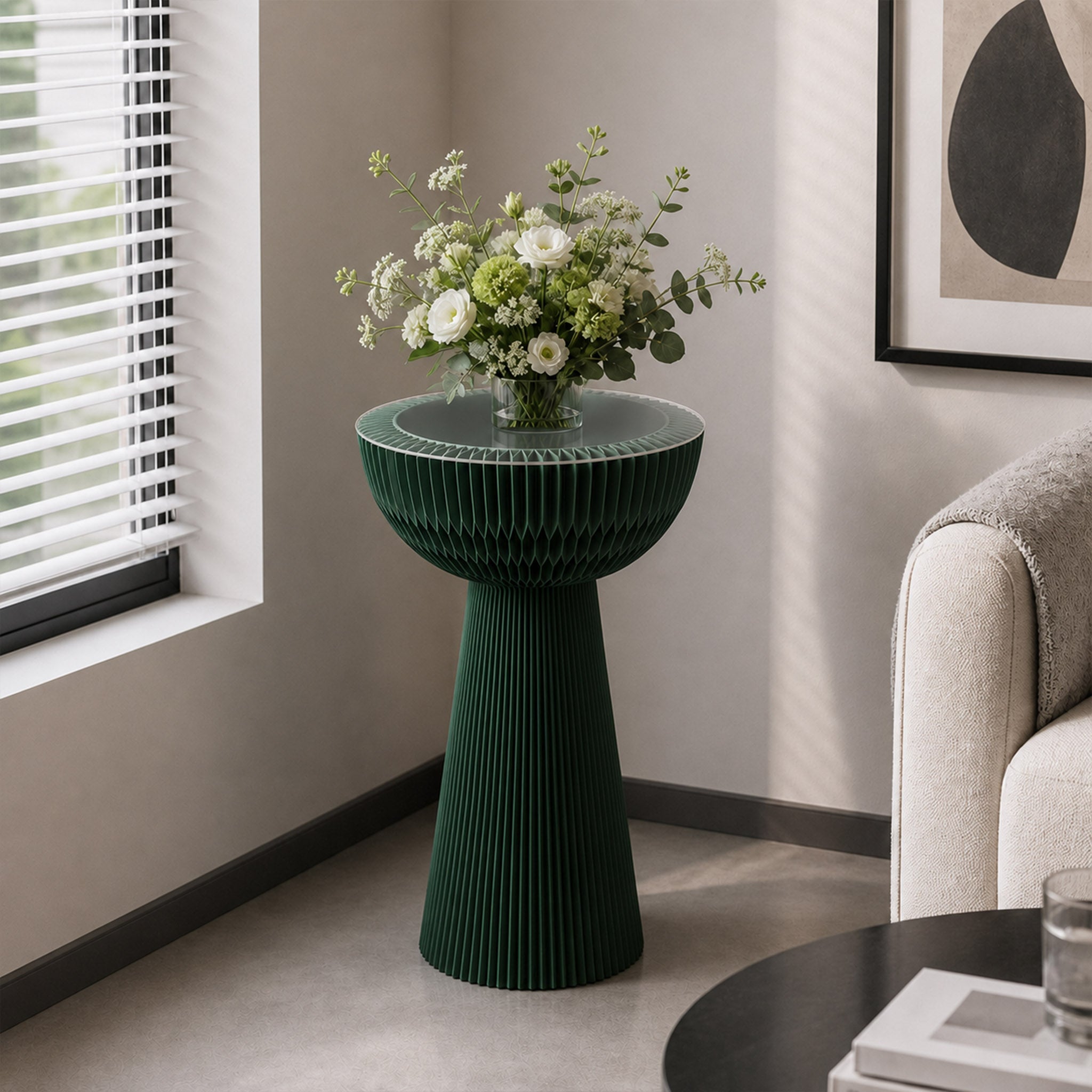 Pine green Bouquet Side Table C styled with a floral arrangement beside a sofa in a contemporary living room.