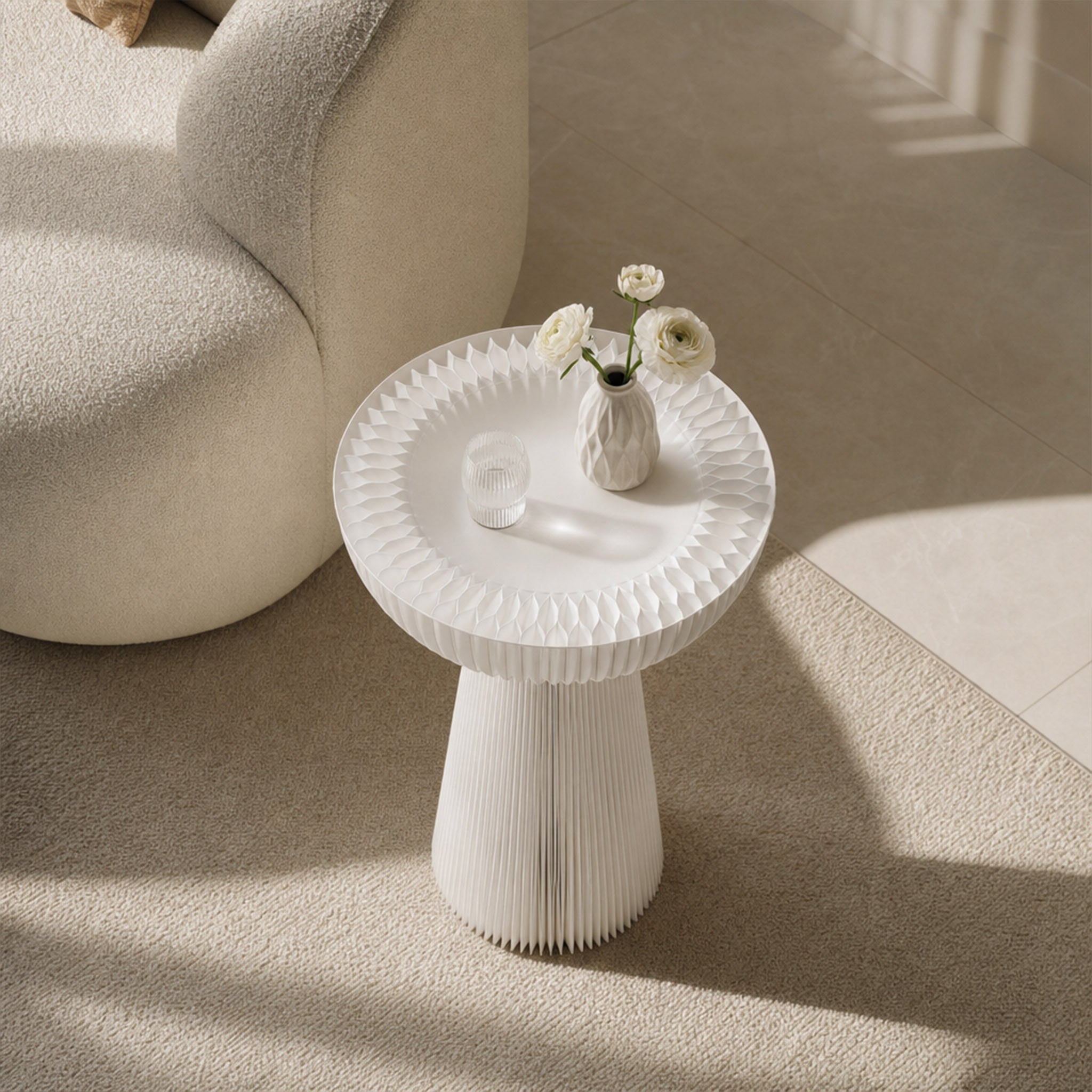 White Bouquet Side Table C with a frosted acrylic top styled beside a curved sofa with flowers and a decorative glass object.
