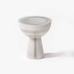 Minimalist white bouquet accordion side table featuring a frosted acrylic top for an elegant living room.
