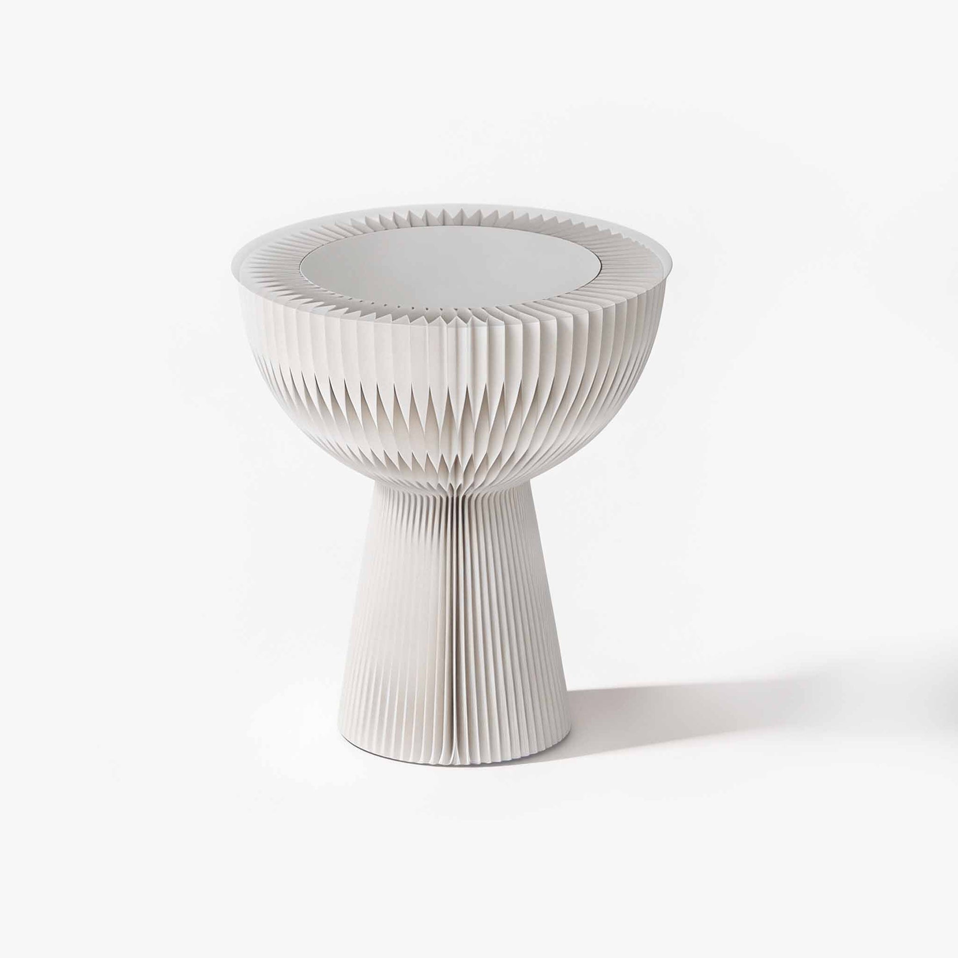 Minimalist white bouquet accordion side table featuring a frosted acrylic top for an elegant living room.