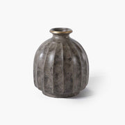 Timeless grey solid brass flower vessel grounded in warm modern organic aesthetics.