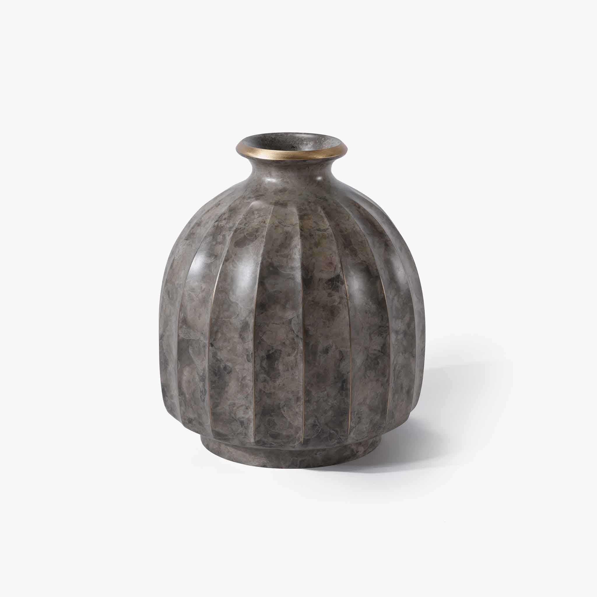 Timeless grey solid brass flower vessel grounded in warm modern organic aesthetics.