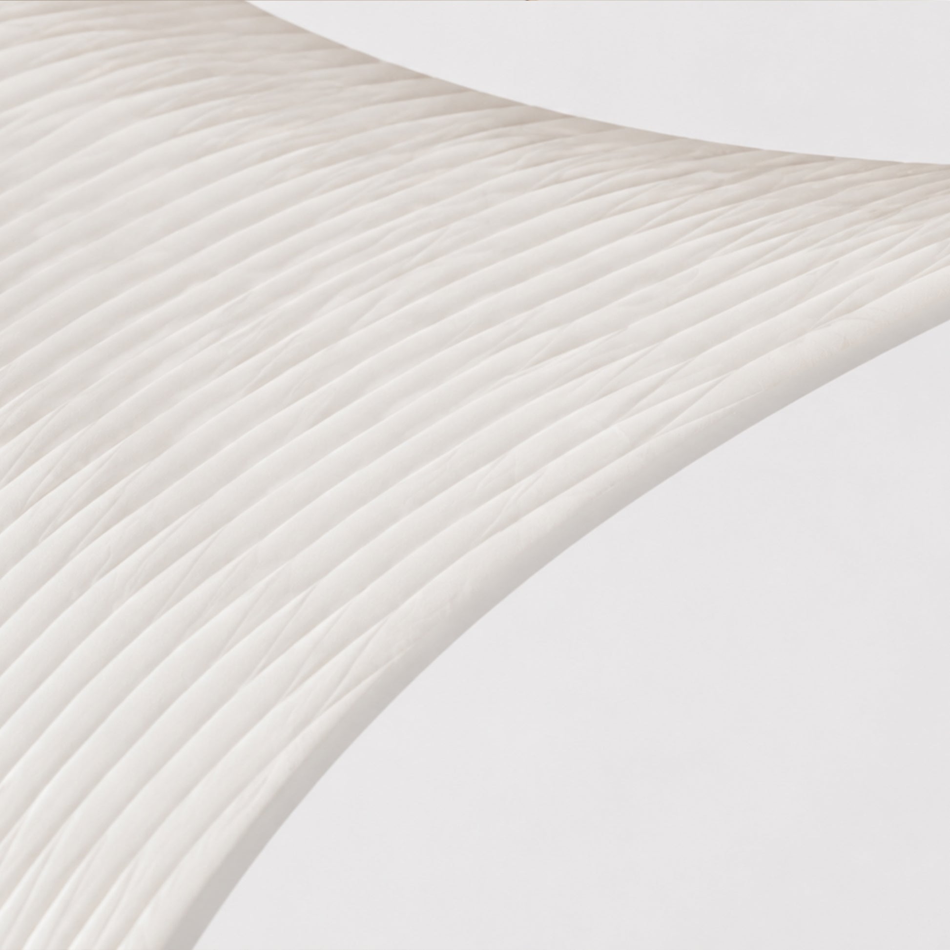 Close-up of the BUTTERFLY side cabinet showing the clear acrylic surface and expandable honeycomb paper structure.