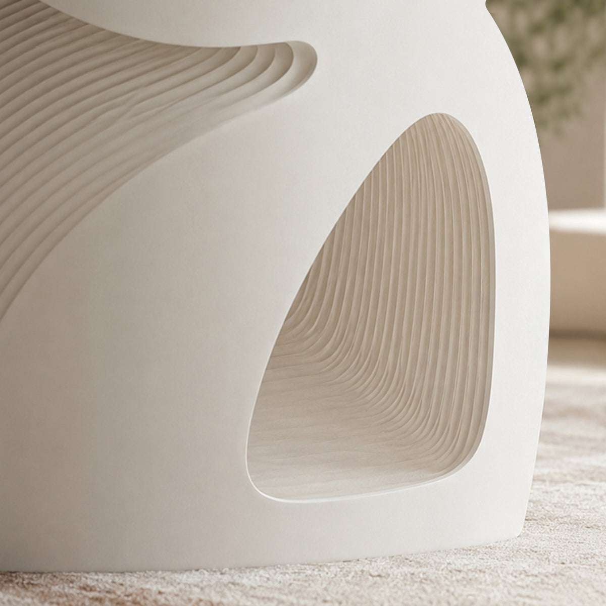 Close-up of the small BUTTERFLY side table showing its curved opening and layered kraft paper honeycomb construction.
