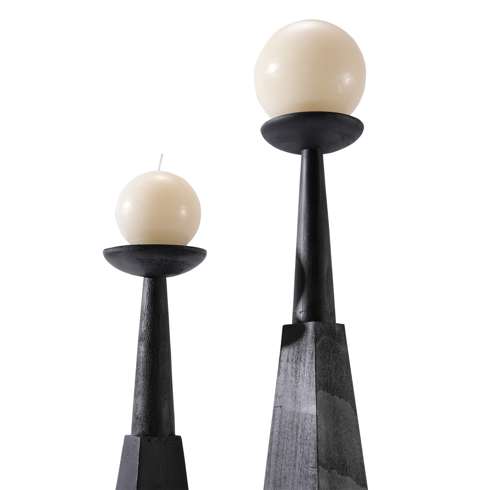 Top view of vintage distressed wood candlesticks elegantly holding glowing spherical candles