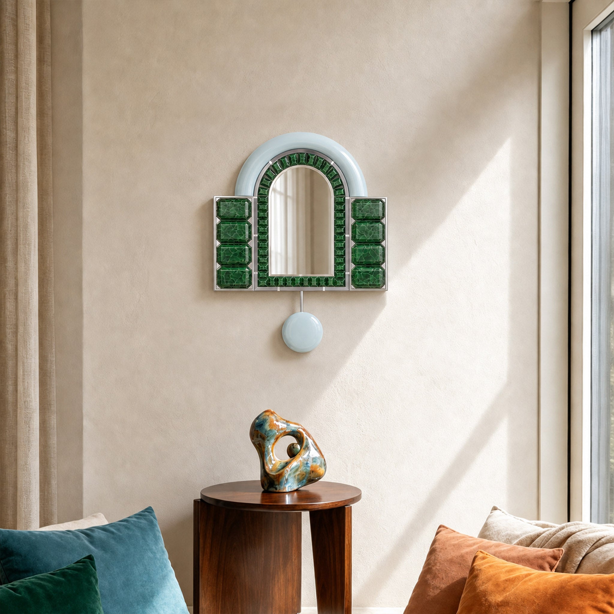 Artamore Celebrity Mirror with recycled green glass frame styled above a sculptural side table in a modern living room.