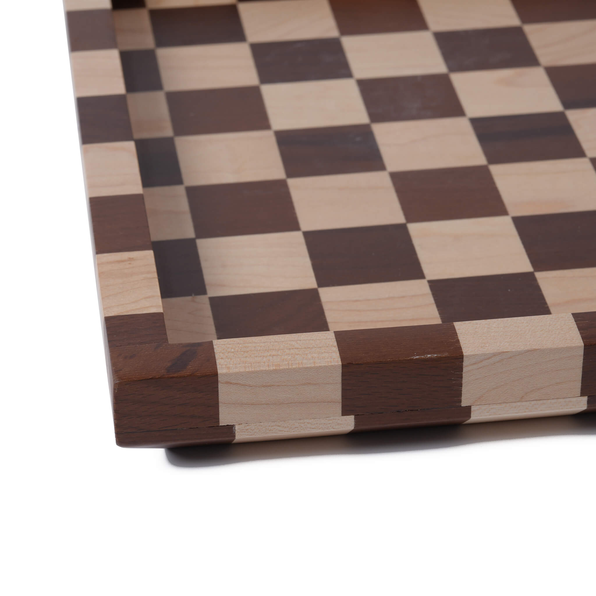 Close-up of the rounded edges and double wood joint craftsmanship on the solid wood checkered tray