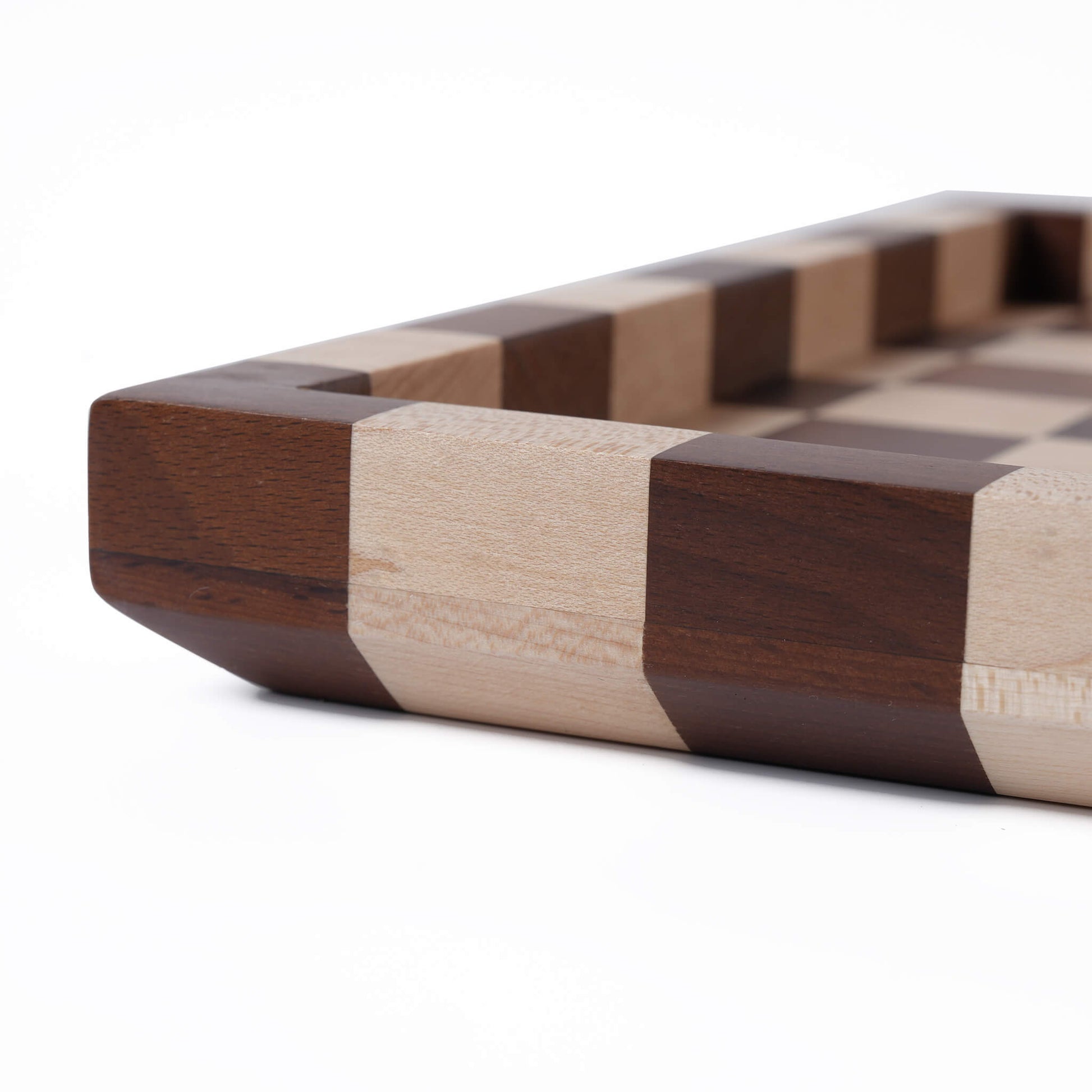 Side profile highlighting the rich contrast between the dark walnut and light maple materials