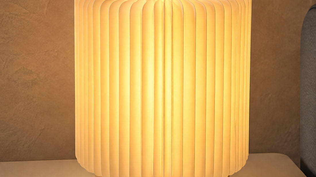 Side profile of the artamore compact reading light, illustrating its space-saving 14-centimeter diameter design that fits effortlessly onto small bedside tables.
