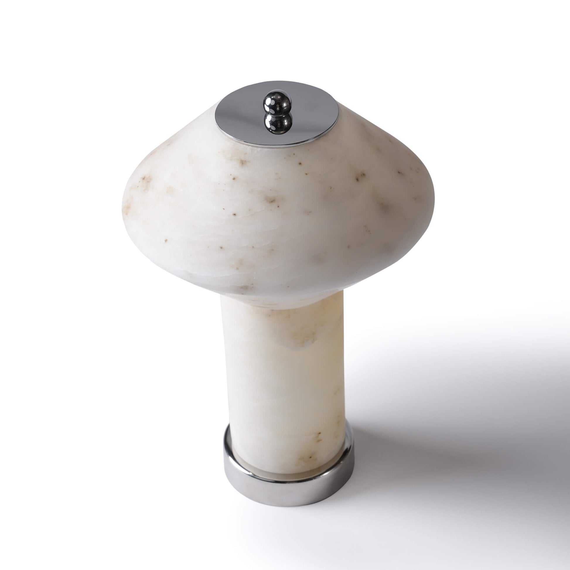 High-angle shot of the rechargeable marble table lamp highlighting the geometric mushroom shade and polished metal top knob