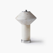 Front view of the unlit cordless alabaster table lamp showing natural stone veining and sleek metal base.