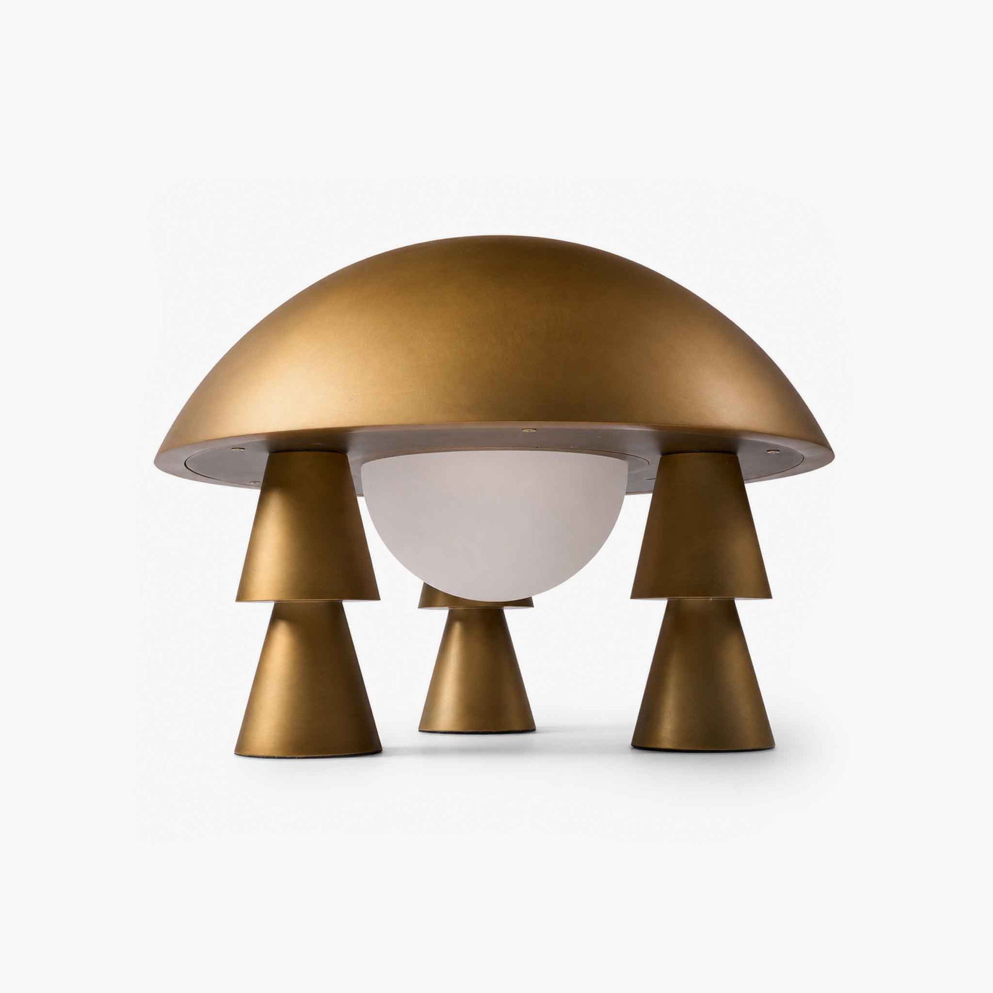 Low angle shot highlighting the frosted milky-white glass shade and hidden touch control base of the metallic table lamp