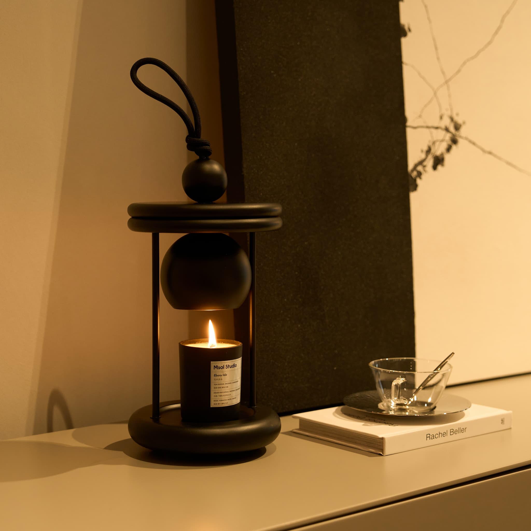 Detailed shot of the thick aesthetic nylon pull cord on the Dawn candle heater top.