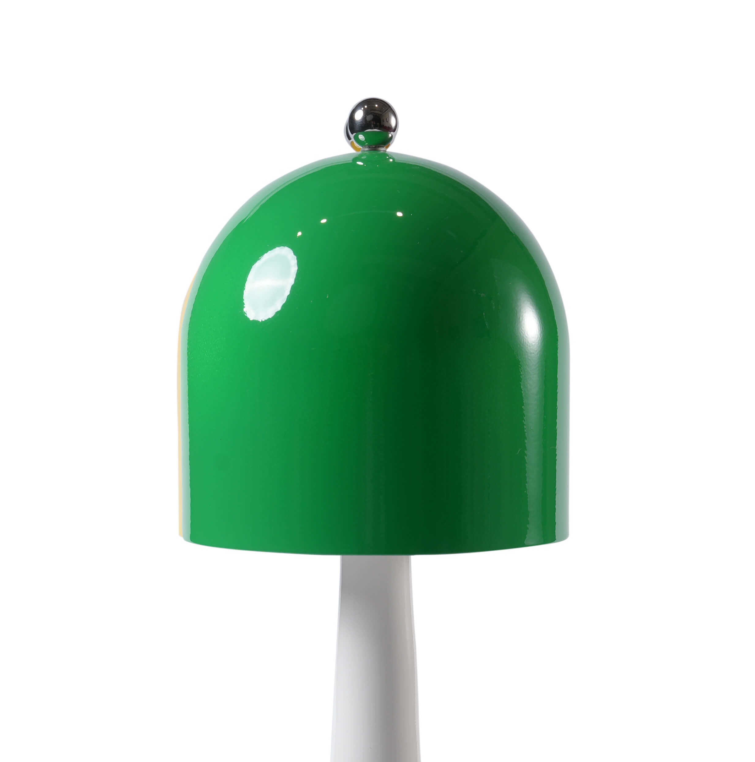 Close-up of the spherical metal touch switch atop the green lampshade of the rechargeable modern desk lamp.