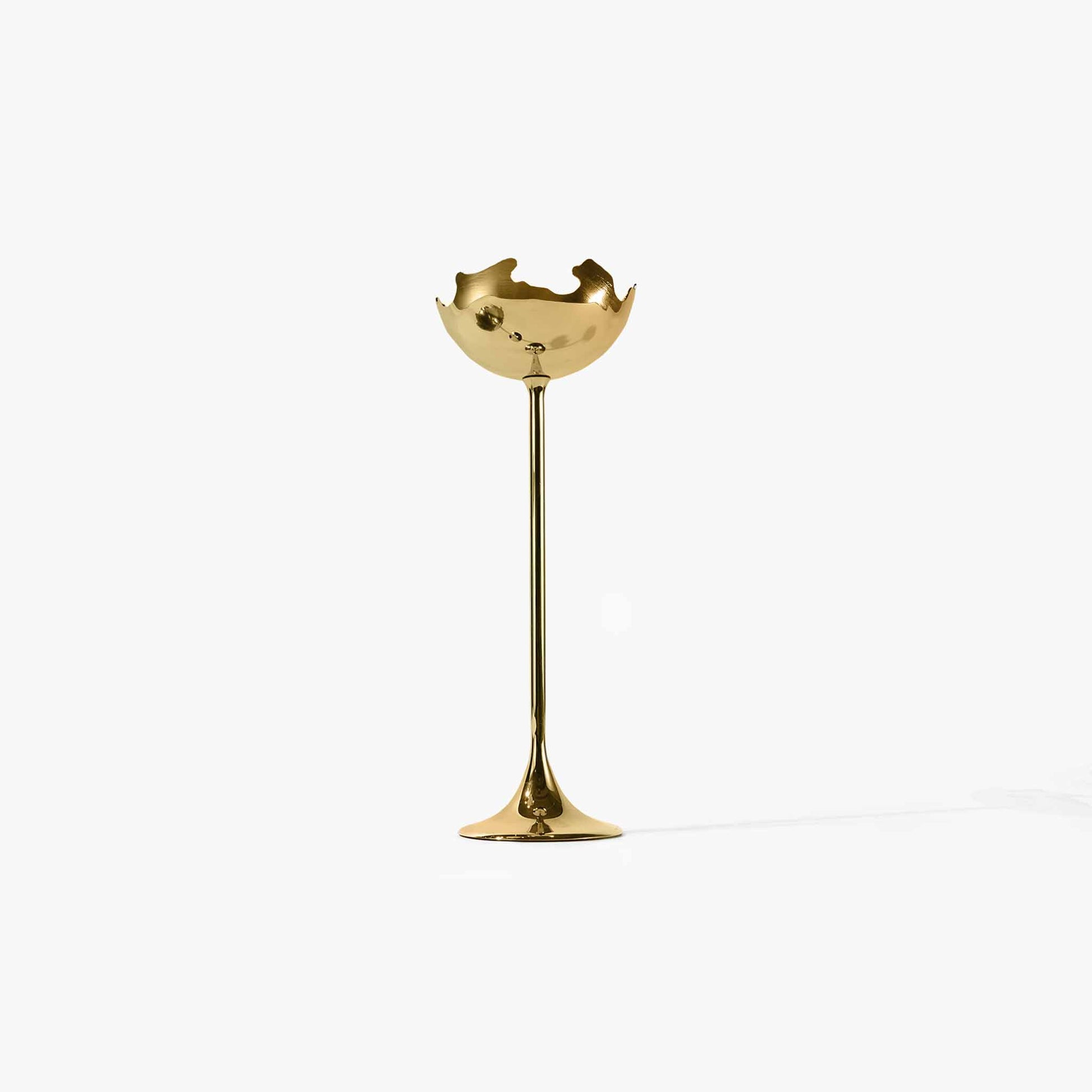 sunset gold metallic eggshell candle holder featuring an organic jagged silhouette.