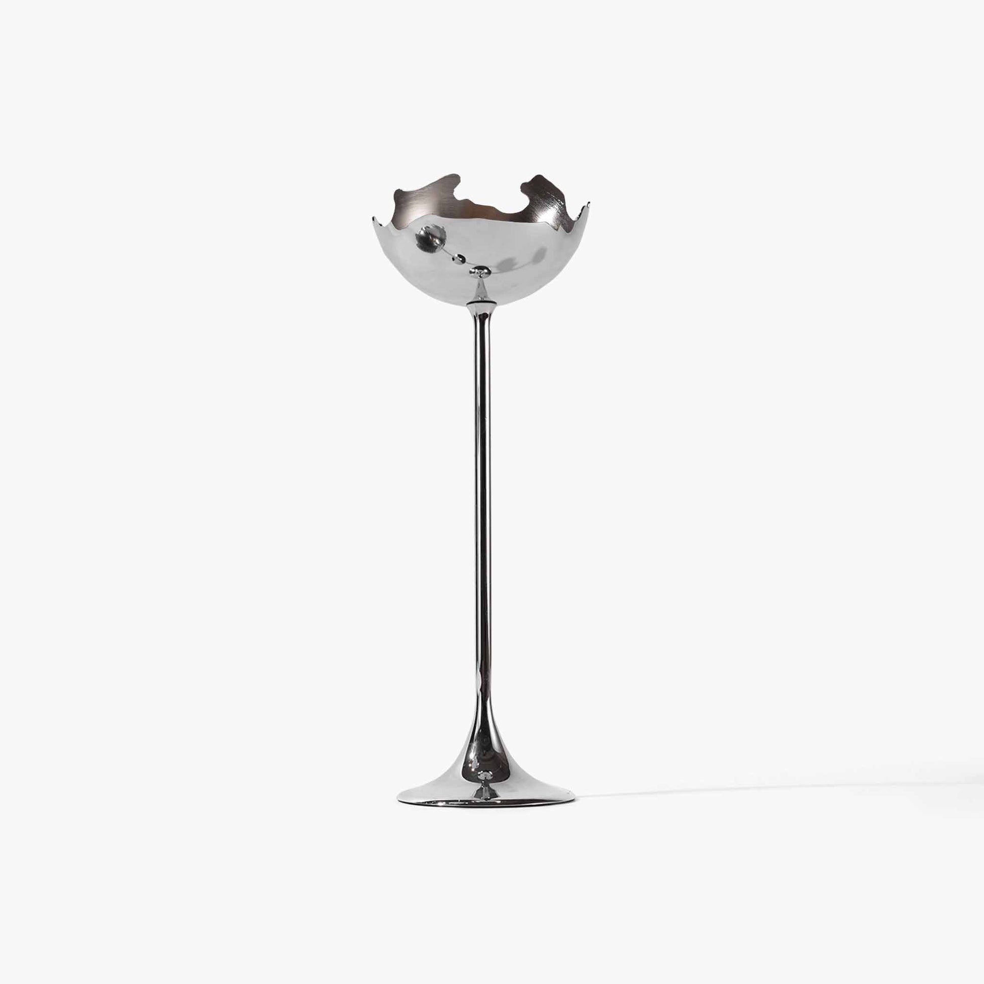 Tall moonlight silver metallic eggshell candle holder featuring an organic jagged silhouette.
