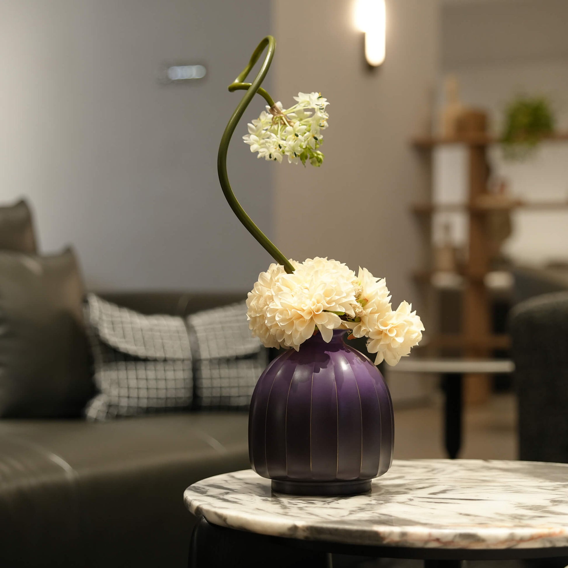 Wabi-sabi metal flower vessel showcasing an elegant and expansive botanical arrangement.