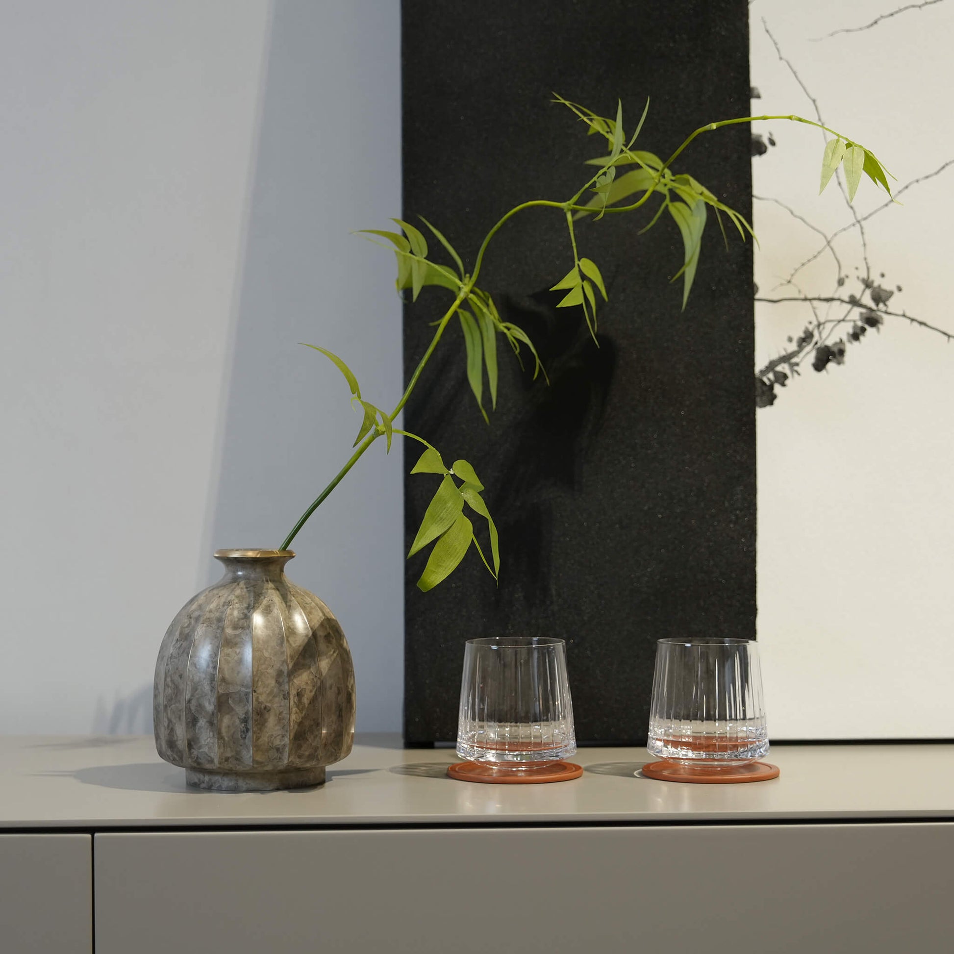 Warm modern organic interior featuring the wabi-sabi metal flower container.