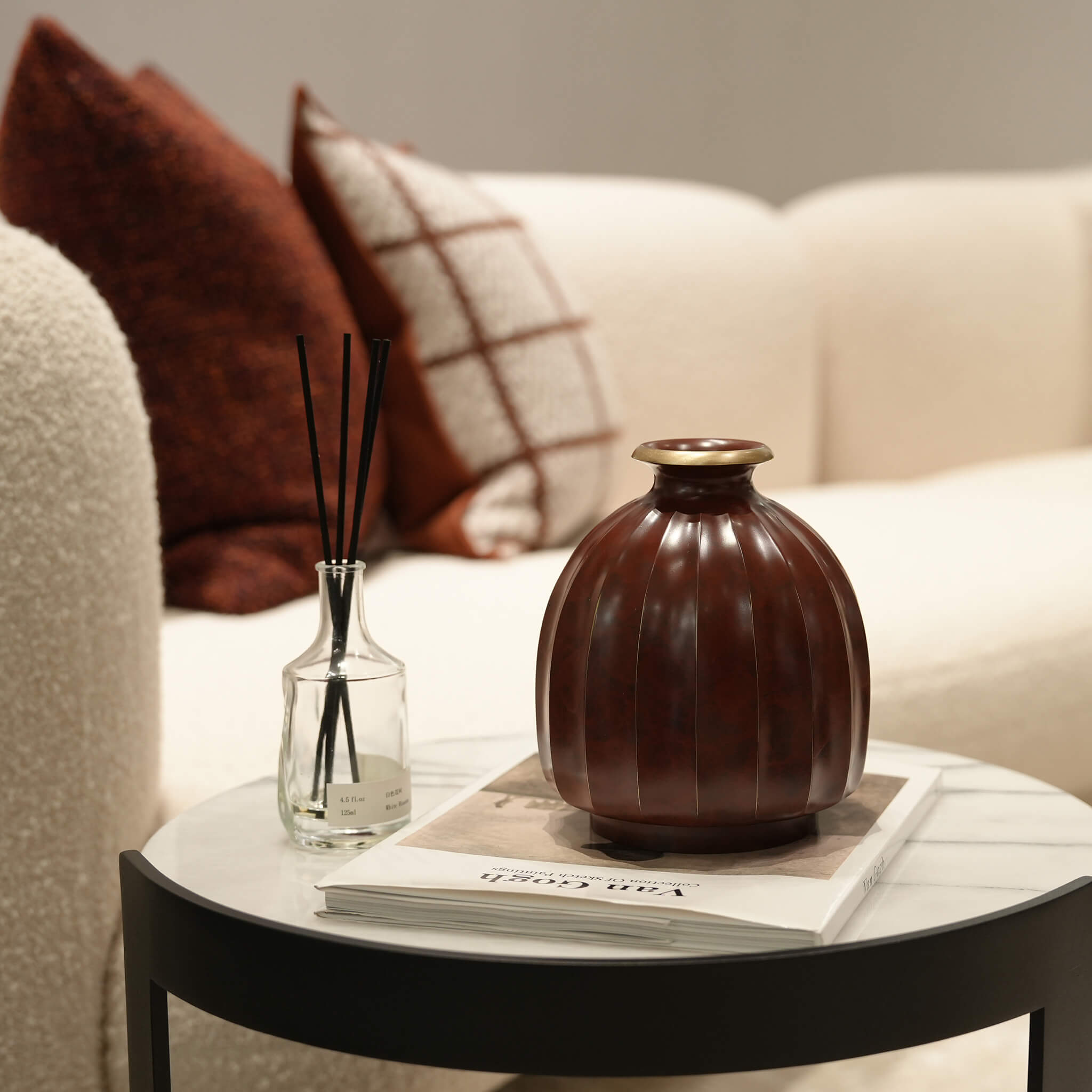 Solid brass lantern centerpiece elevating a sophisticated dining table atmosphere.