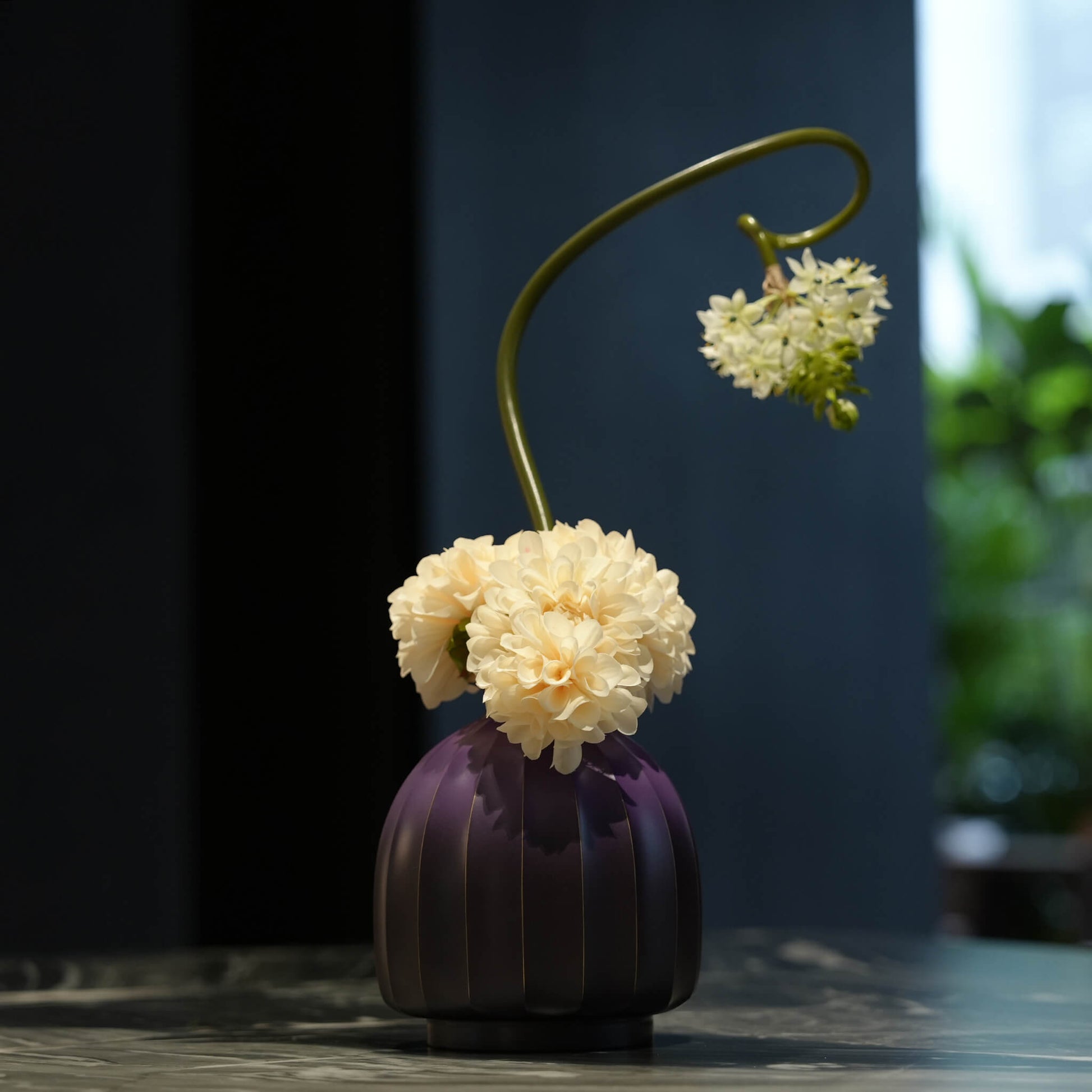 Detail of the heavy brass sculptural vase highlighting its luminous and organic thermal patina.