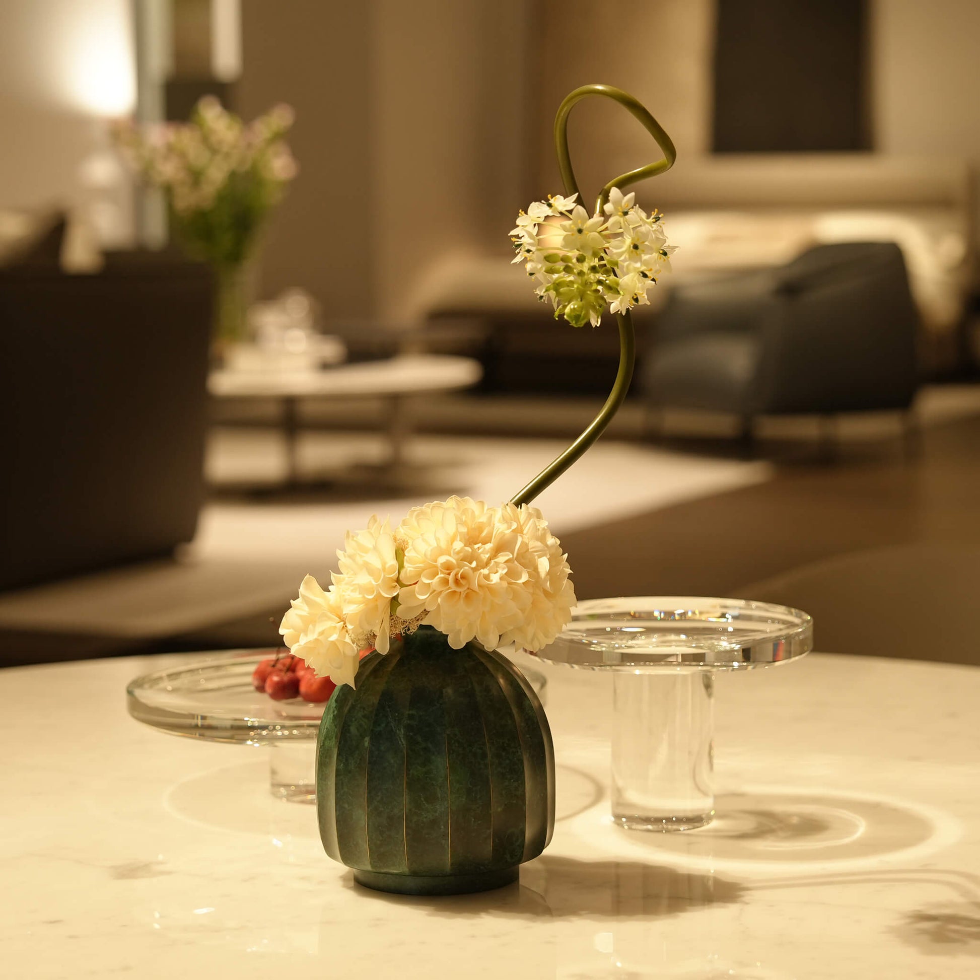 Top angle view of the modern eclectic metal sculptural vase highlighting its narrow opening.