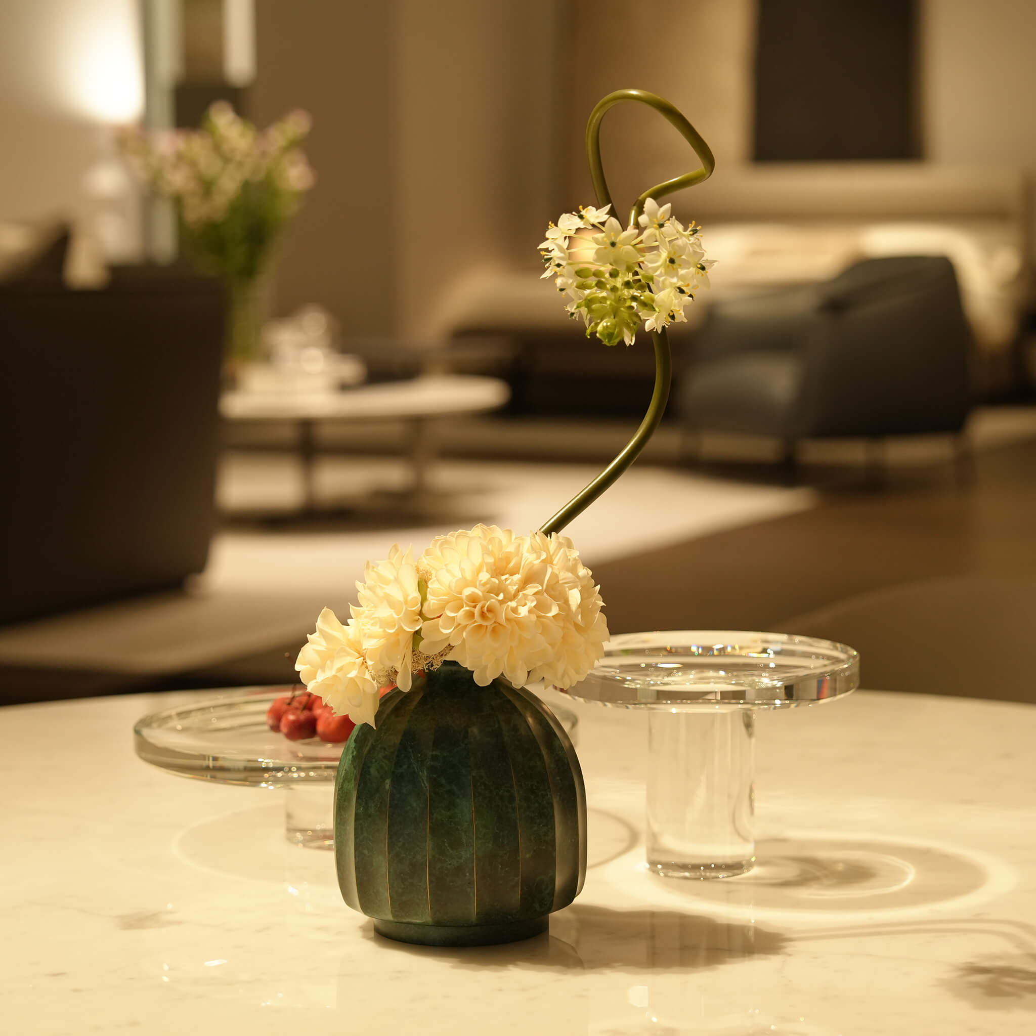 Top angle view of the modern eclectic metal sculptural vase highlighting its narrow opening.