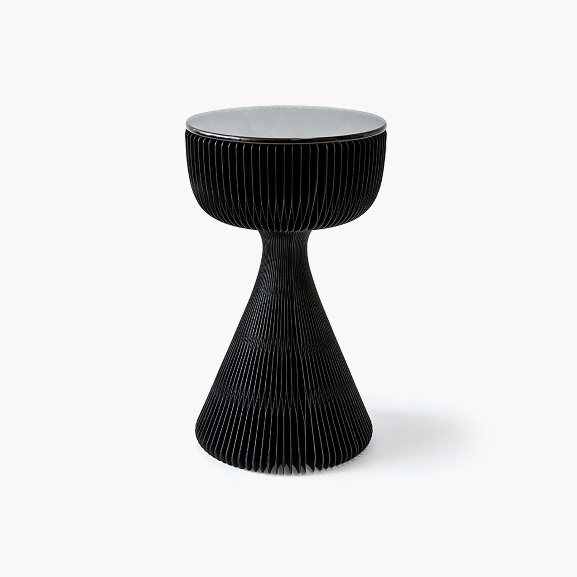Elegant black kraft paper side table featuring an hourglass silhouette and tempered glass top.