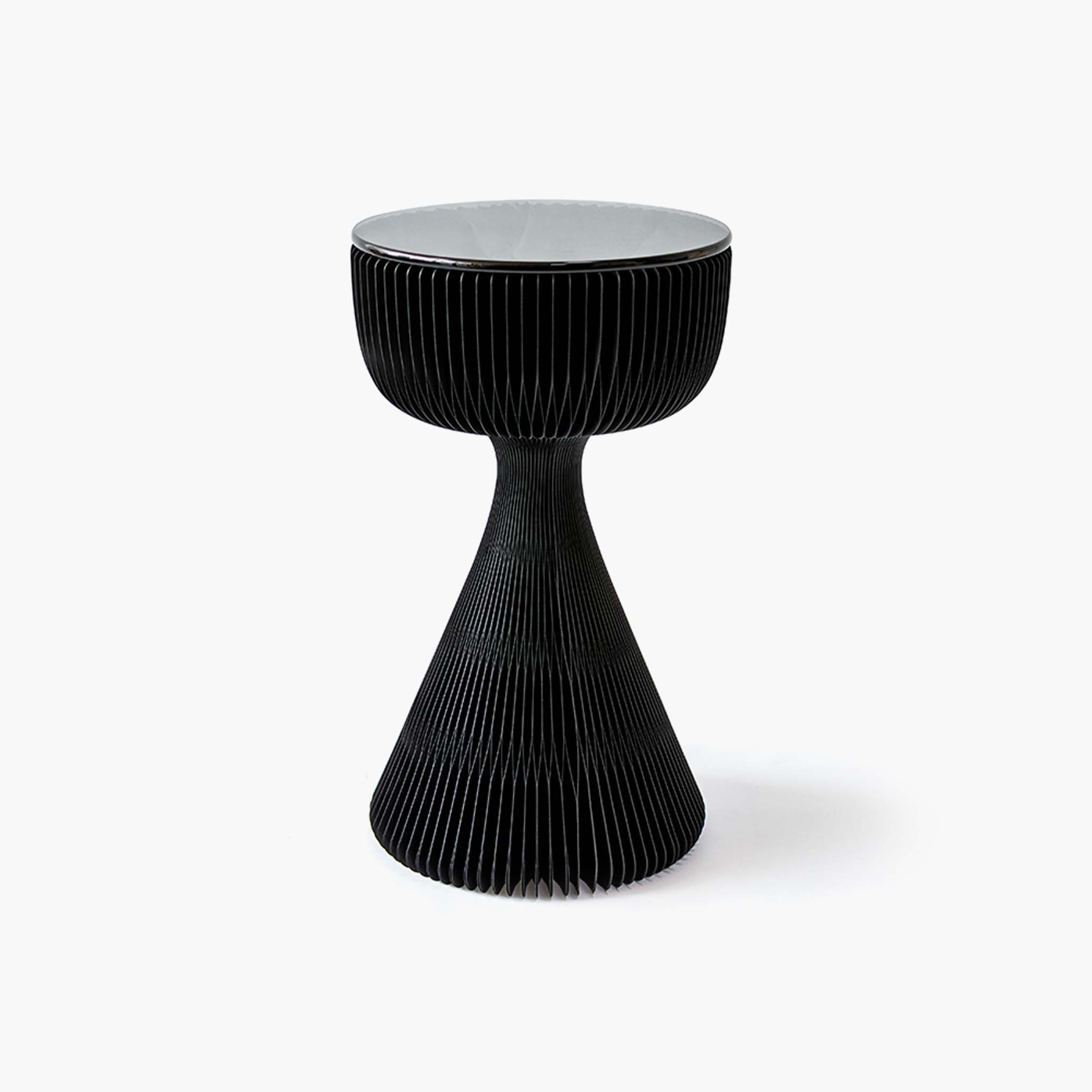 Elegant black kraft paper side table featuring an hourglass silhouette and tempered glass top.