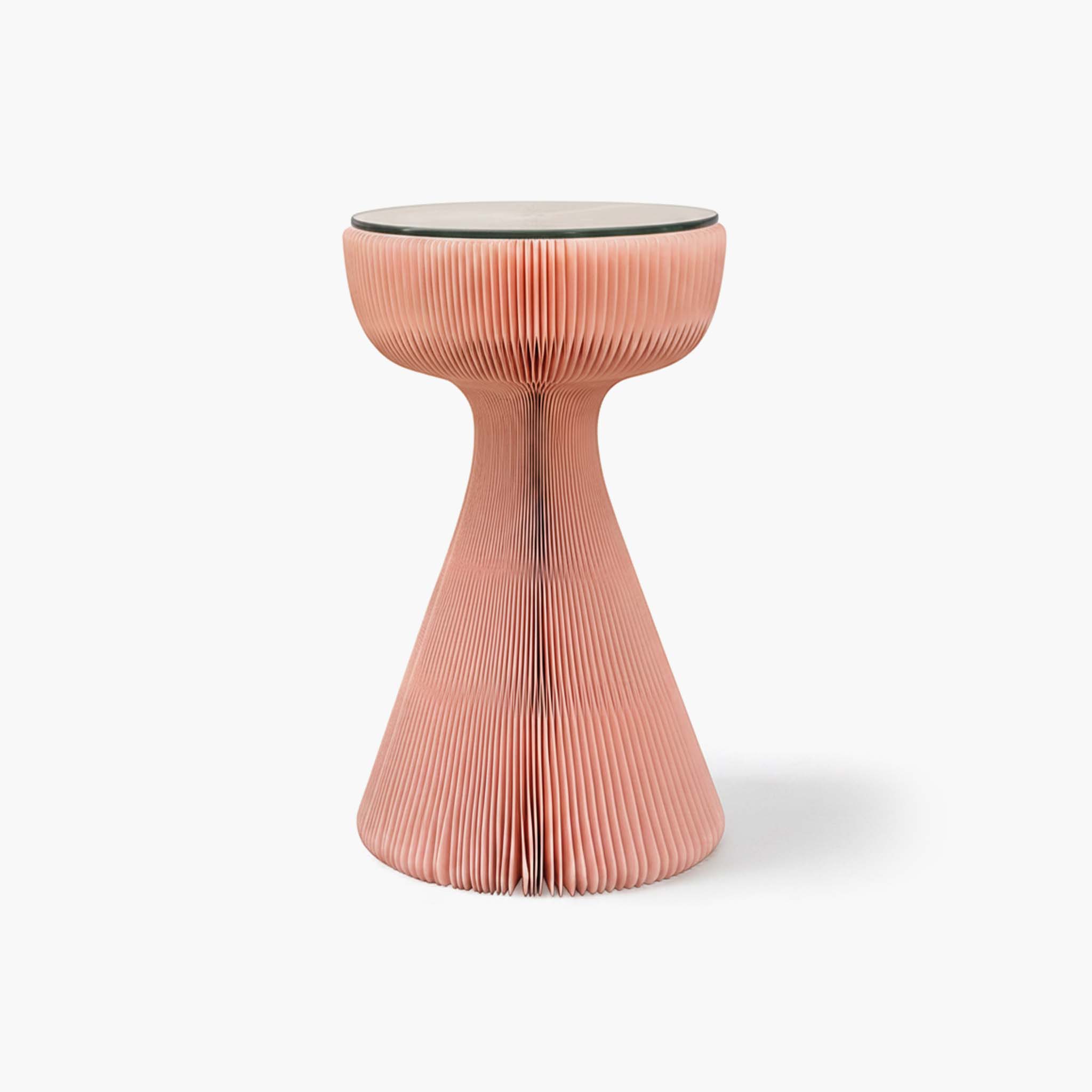 Soft pink folding bedside table showcasing an elegant waist-cinching design and glass surface.