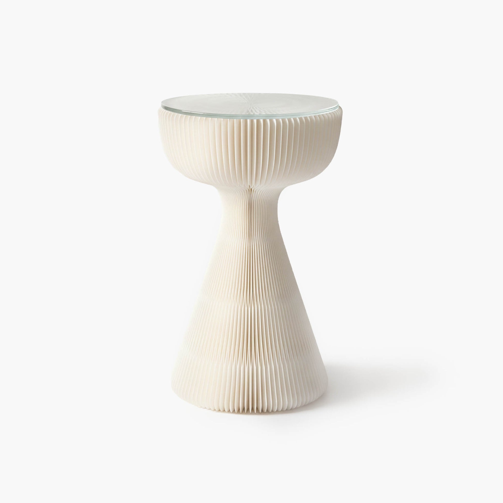 Minimalist white honeycomb side table combining architectural aesthetics with haute couture inspiration.