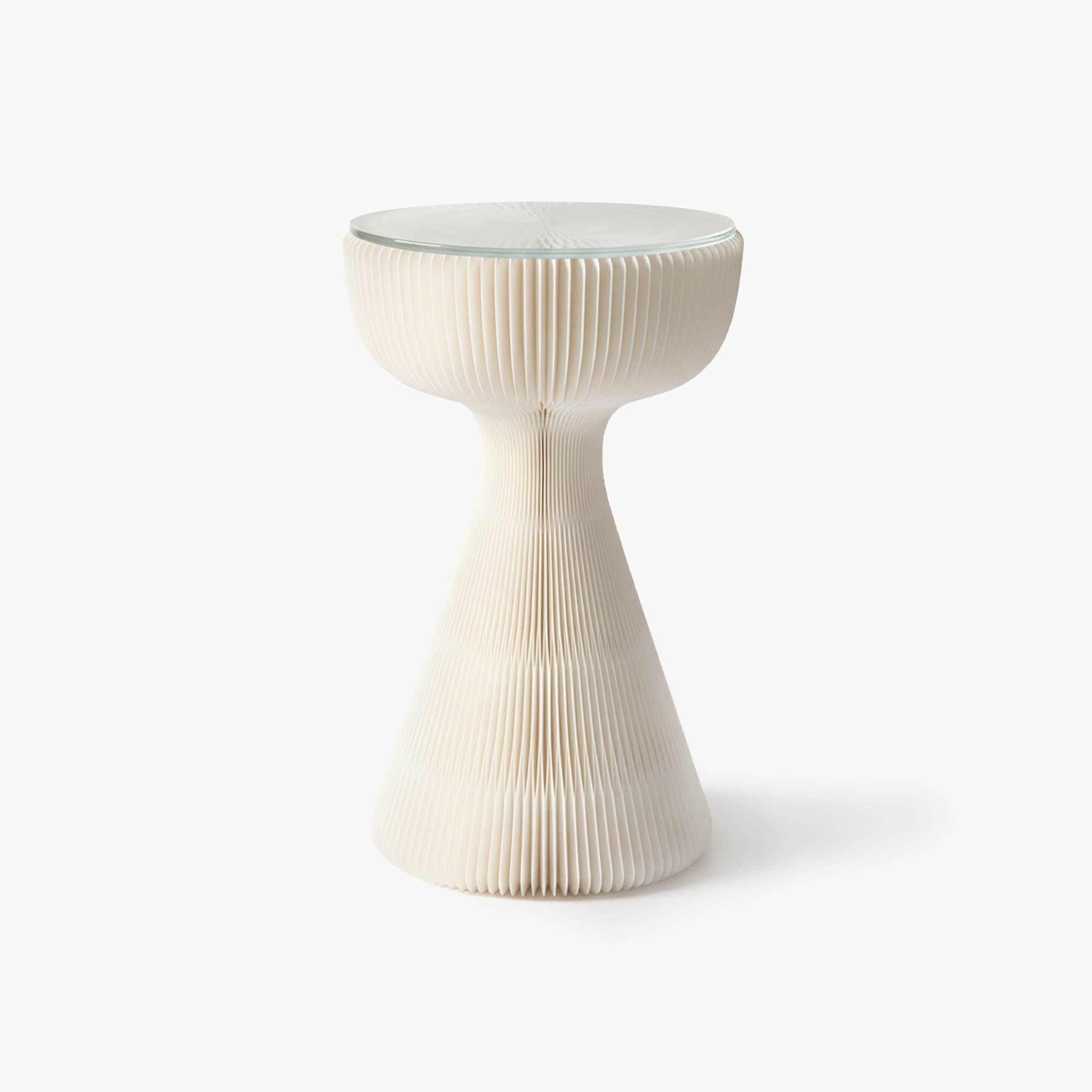 Minimalist white honeycomb side table combining architectural aesthetics with haute couture inspiration.