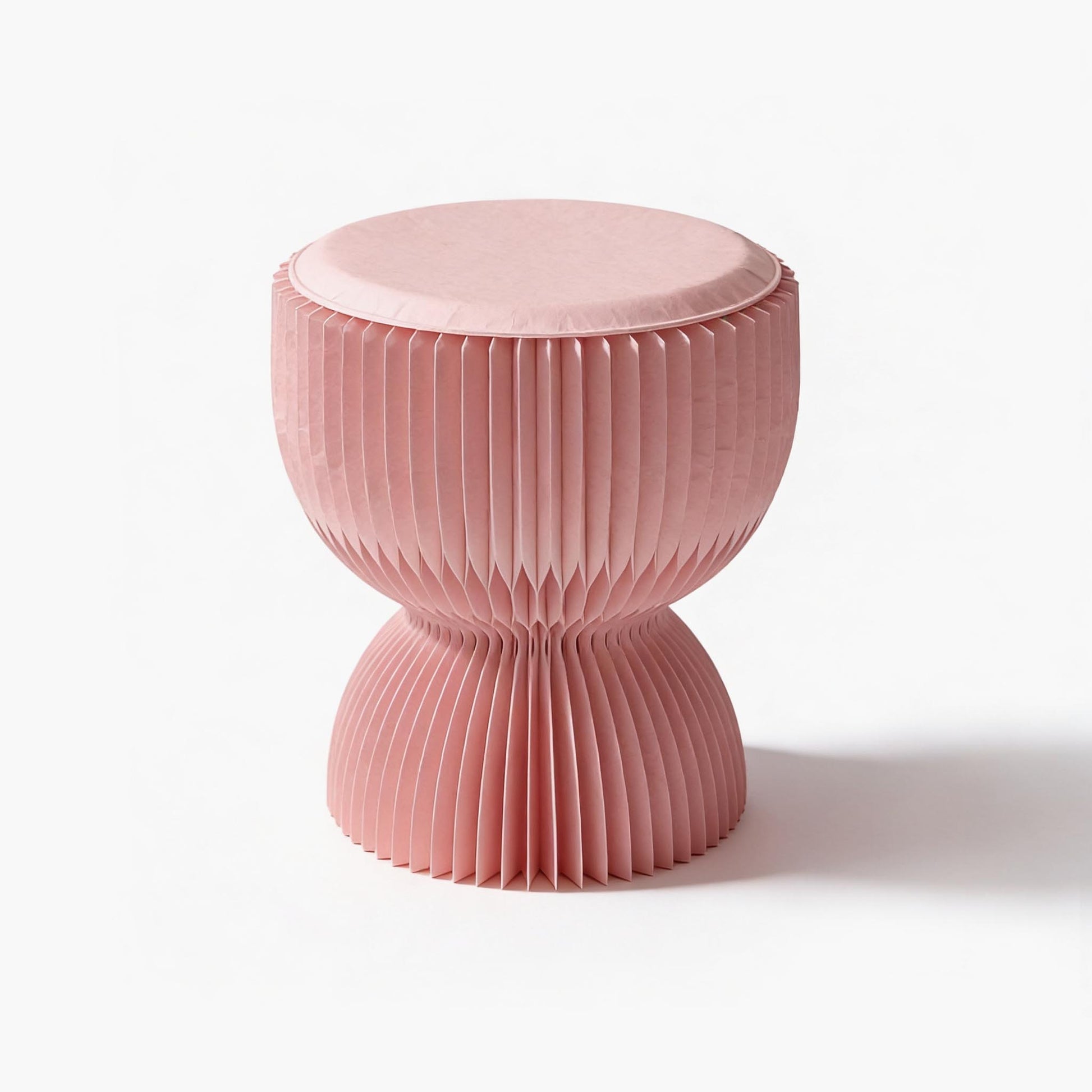 Luxury pleated kraft paper pouf in blush pink with tailored PU leather seat by ARTAMORE.