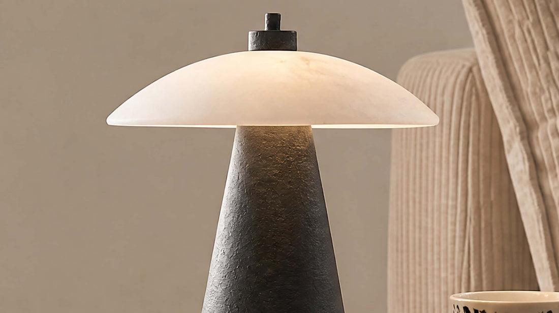 Macro photography of the artamore luxury marble light, capturing the sophisticated fusion and tactile contrast between the warm marble and sleek black metal.