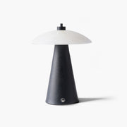 Minimalist black marble night light featuring a textured metal base and natural stone shade for quiet luxury spaces.