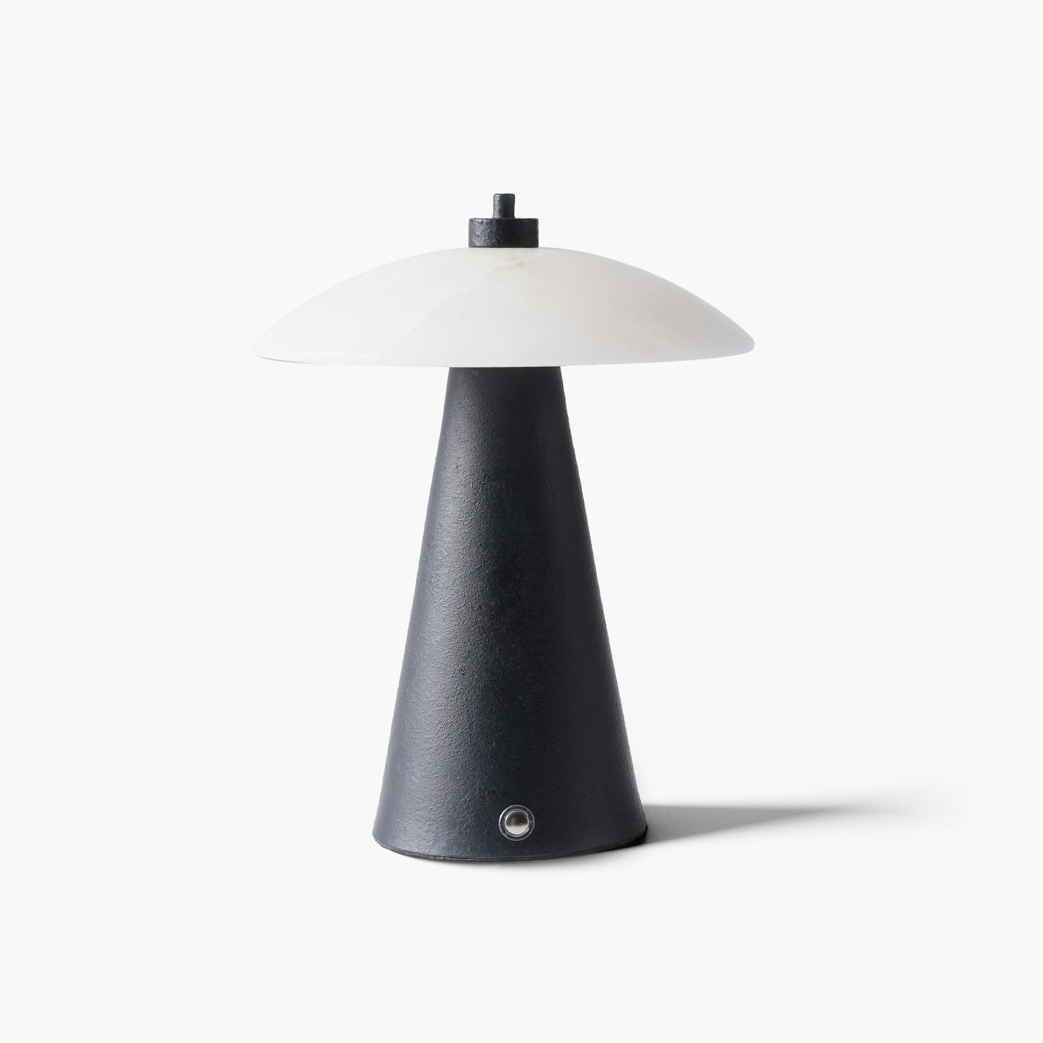 Minimalist black marble night light featuring a textured metal base and natural stone shade for quiet luxury spaces.