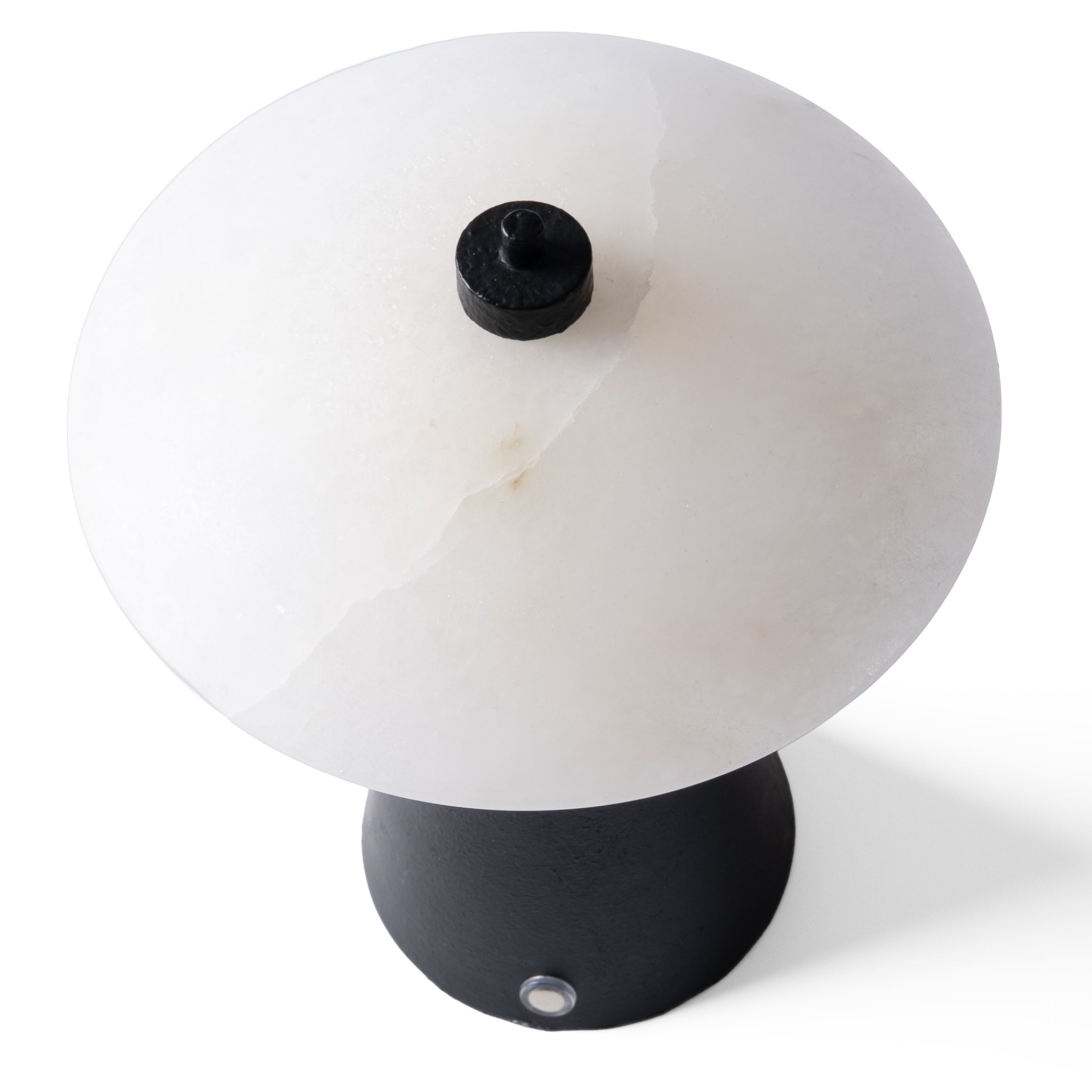 Top view of the natural marble lampshade highlighting its unique veining and warm light transmission.