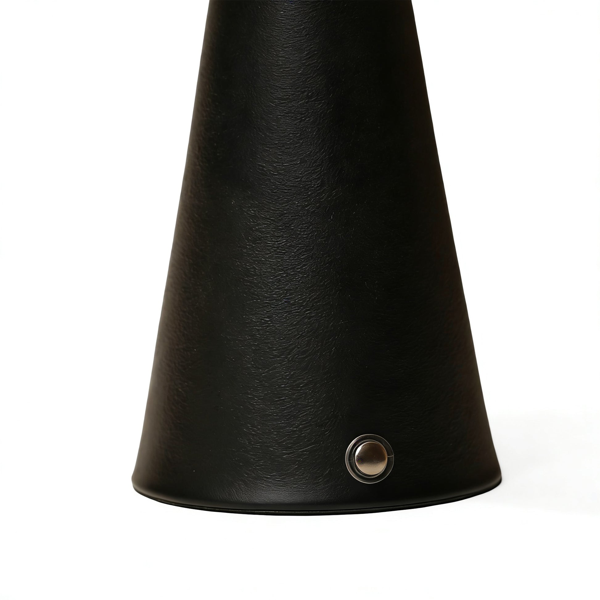 Close-up of the sophisticated textured black metal base on the modern organic ambient lamp.