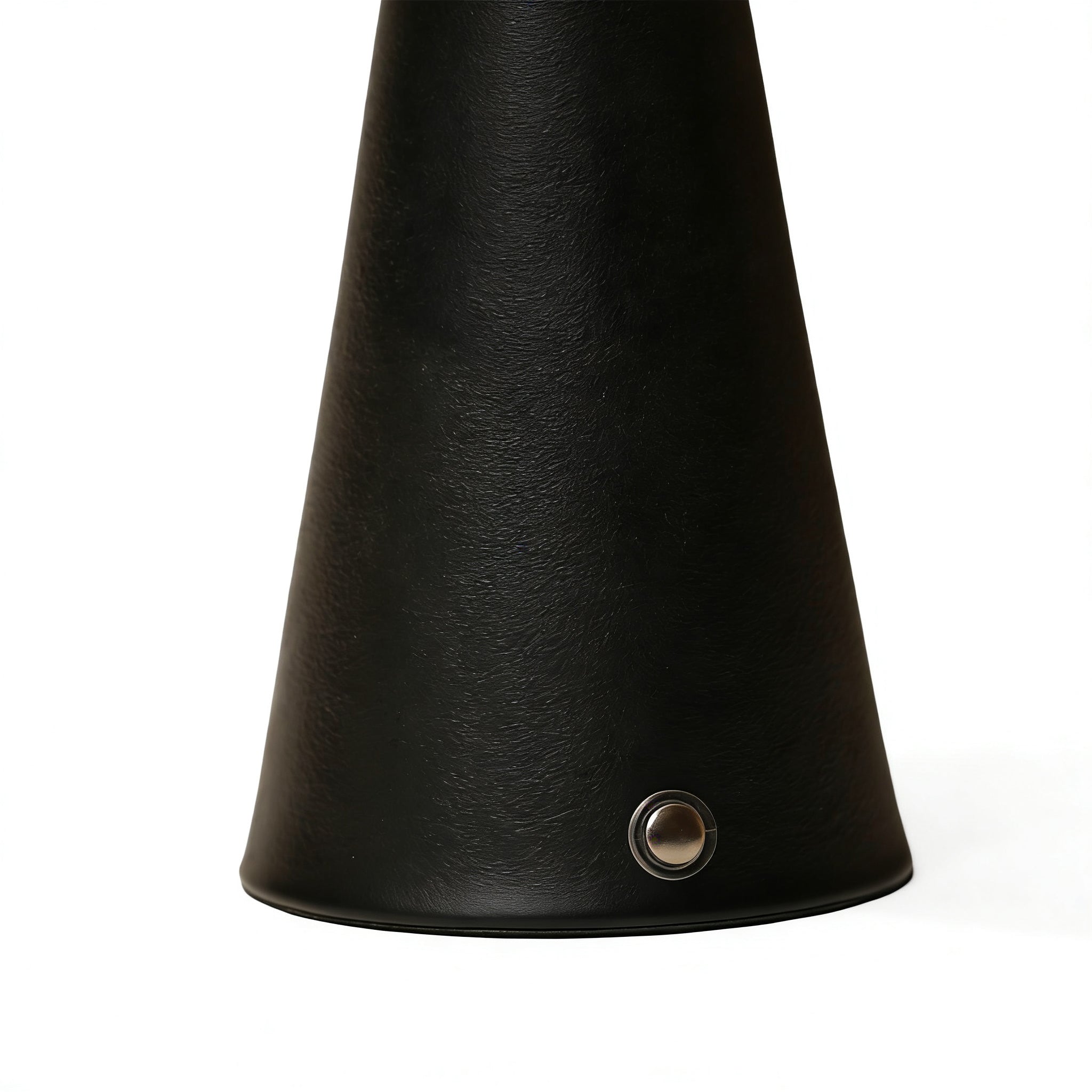 Close-up of the sophisticated textured black metal base on the modern organic ambient lamp.